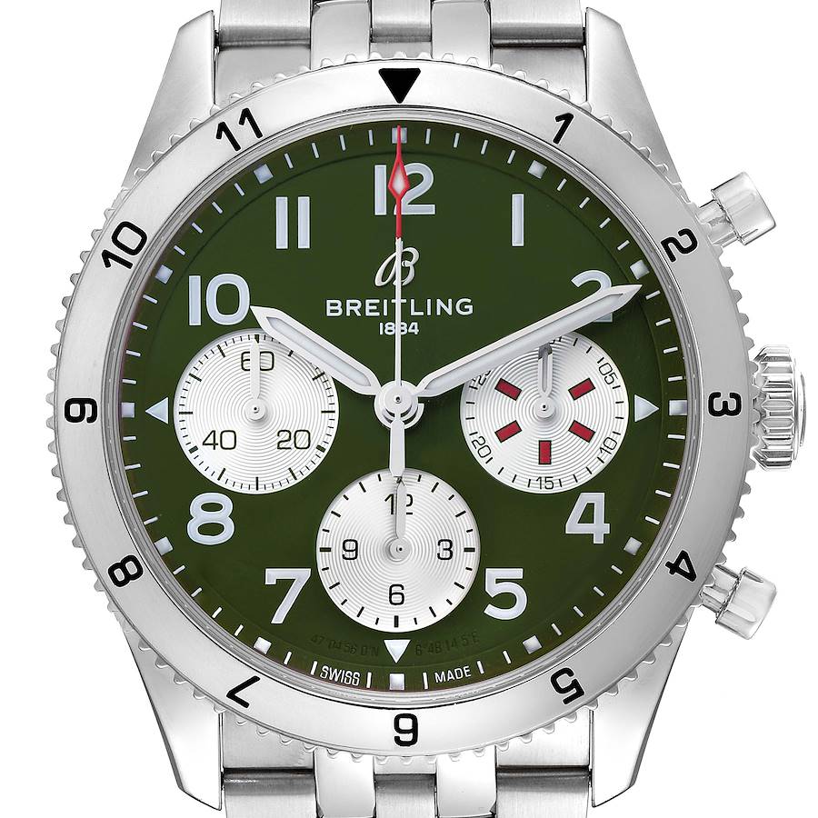 The image shows a frontal view of the Breitling Aviator watch, highlighting its green dial, chronograph sub-dials, and stainless steel bracelet.