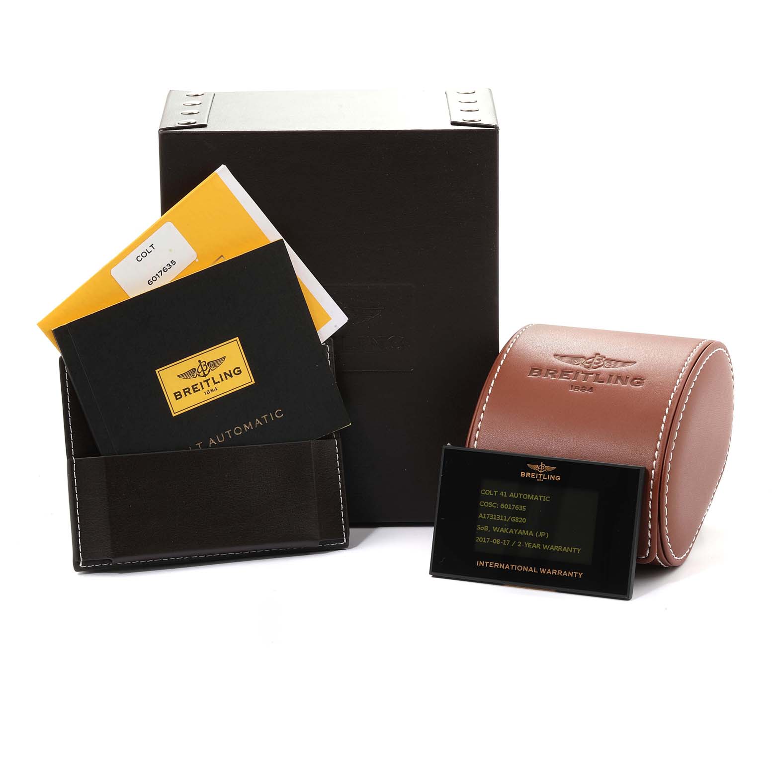 This Breitling Colt A17313 Men
s Stainless Steel White Dial A17313 Men
s Stainless Steel White Dial watch set includes the box, warranty card, manual, and leather travel case, photographed from a front angle.