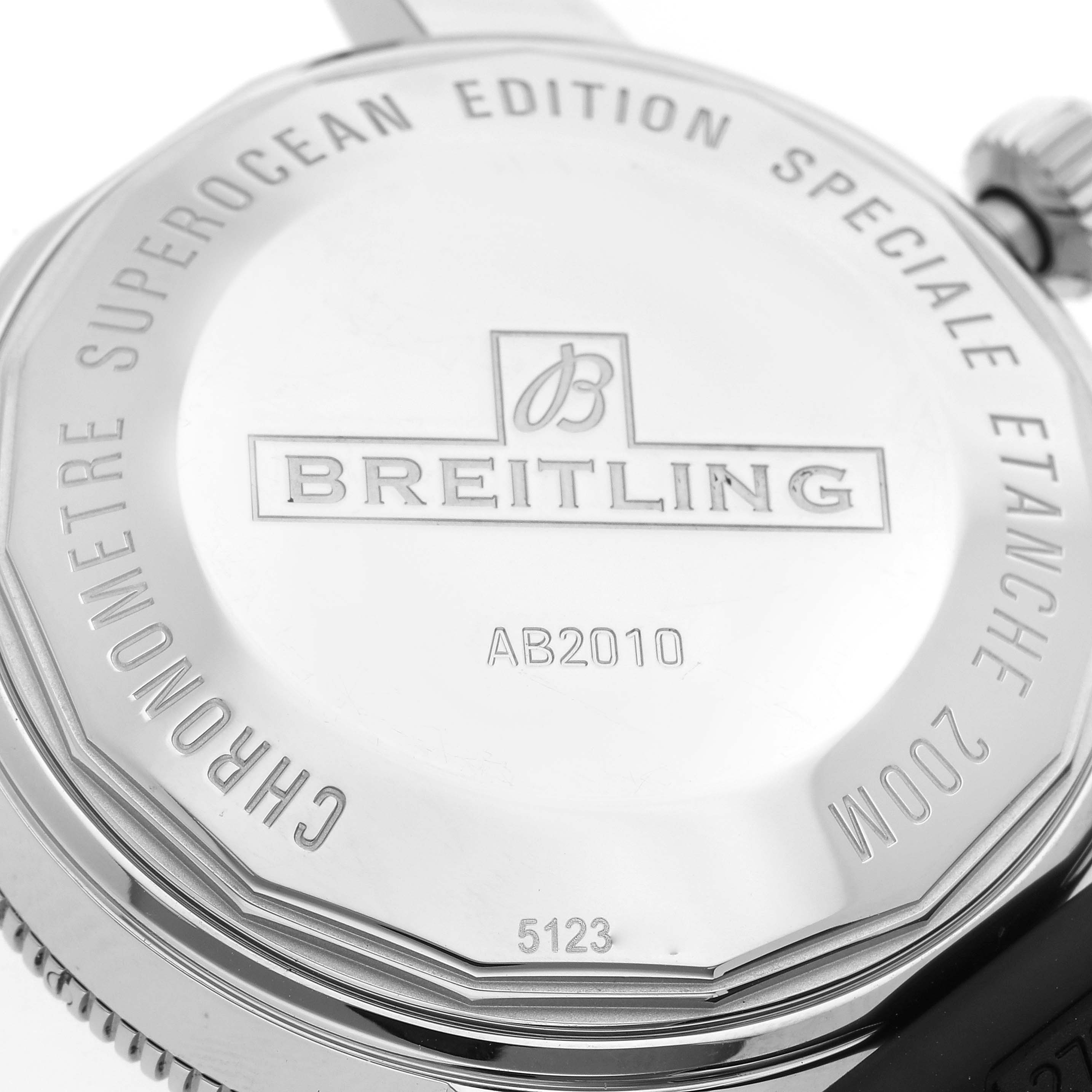 This image shows the case back of a Breitling Superocean AB2010 Men's Stainless Steel Green Dial AB2010 Men's Stainless Steel Green Dial watch, featuring the brand's name, model number AB2010, and specifications.