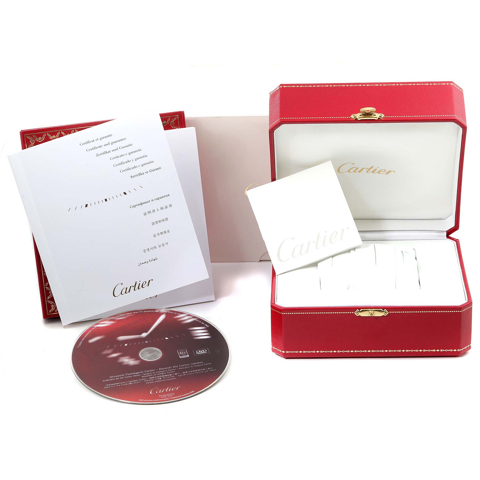 This image shows accessories for the Cartier Pasha W3140008 Women's Stainless Steel Pink Dial W3140008 Women's Stainless Steel Pink Dial watch, including the box, user manuals, and a CD, all arranged at a straight-on angle.