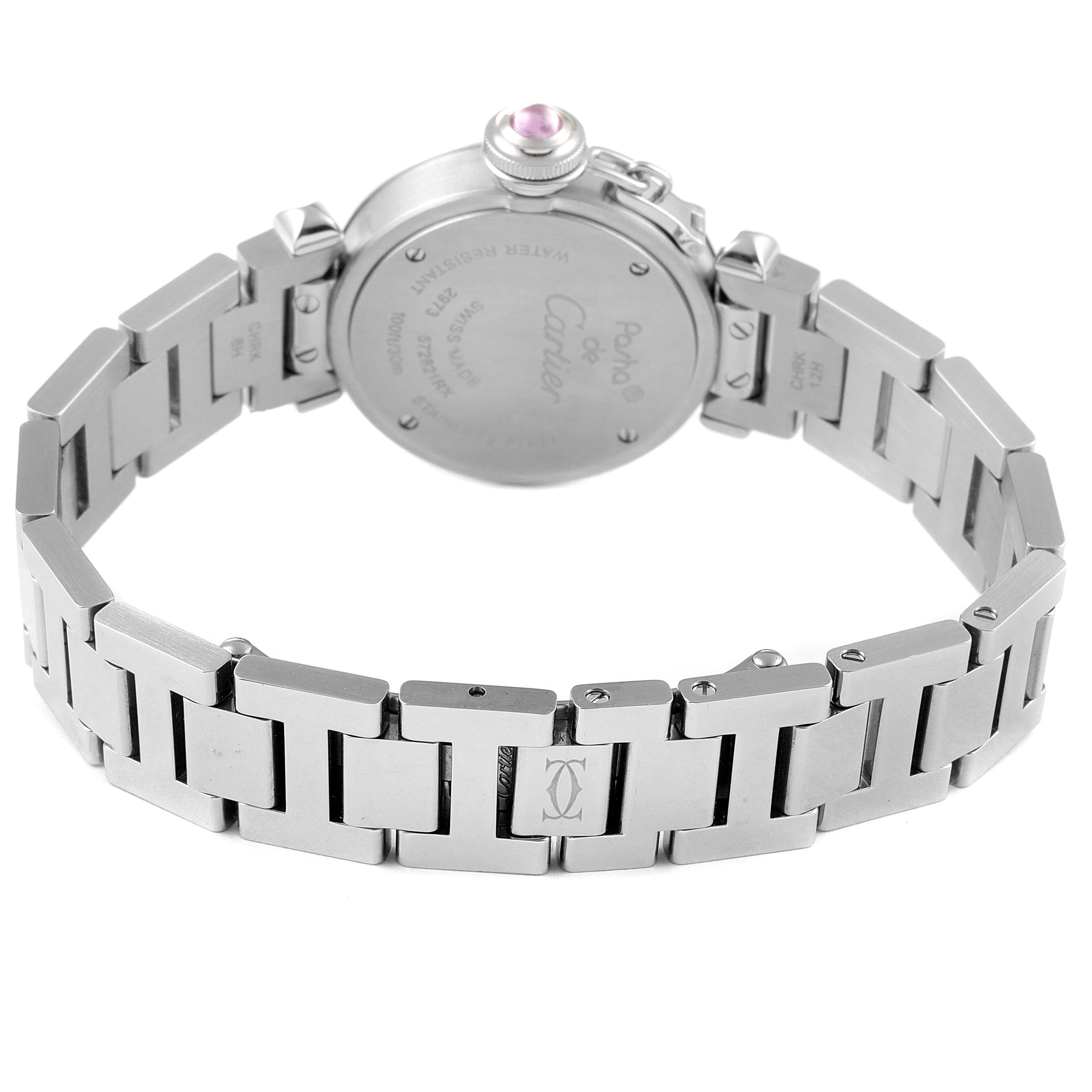 The image shows the back view and bracelet of the Pasha de Cartier watch, highlighting its stainless steel band and case back.