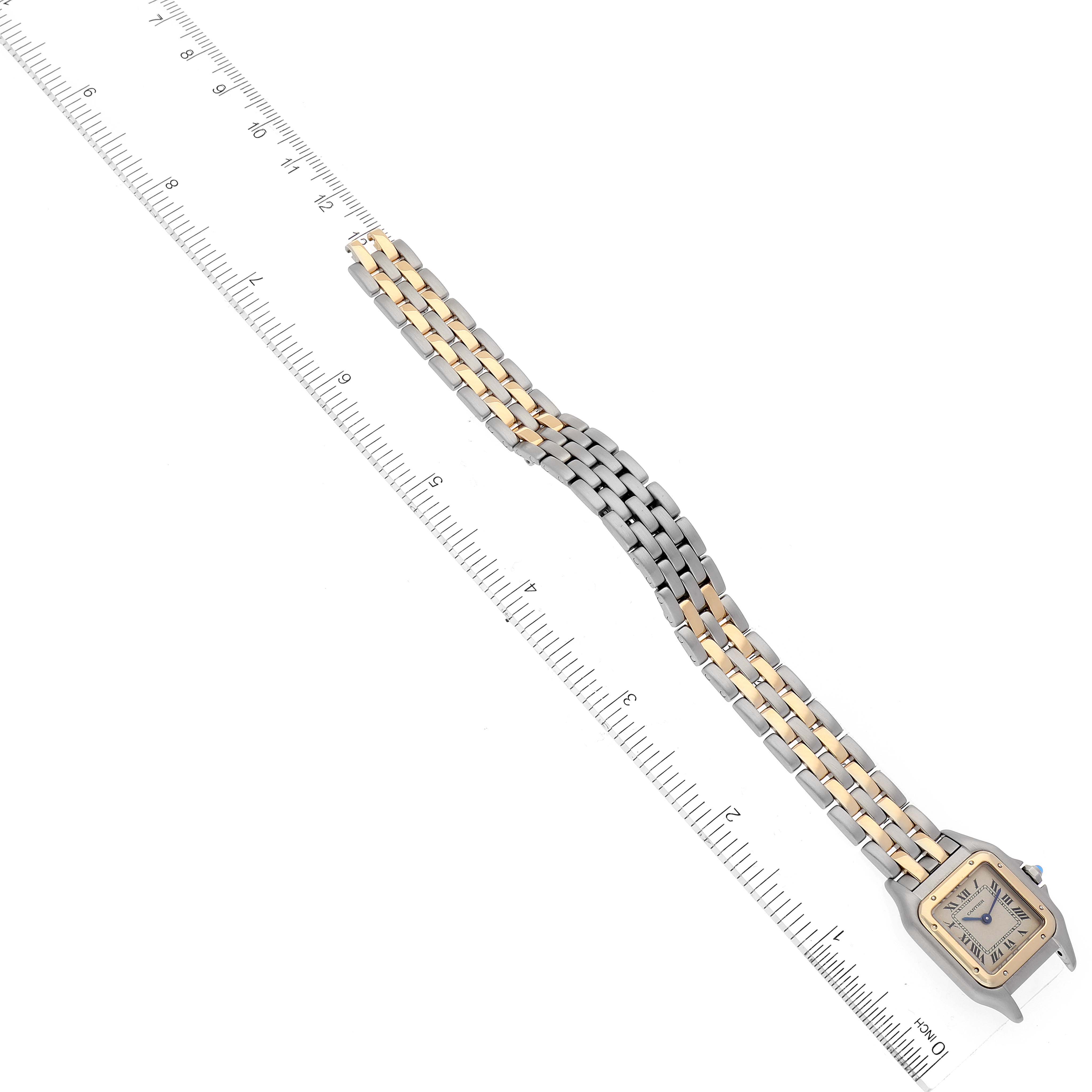 This image shows a Cartier Panthere W25029B6 Women
s Steel and Gold (two tone) Silver Dial W25029B6 Women
s Steel and Gold (two tone) Silver Dial model watch from a top-down angle, featuring the face and bracelet next to a ruler for scale.