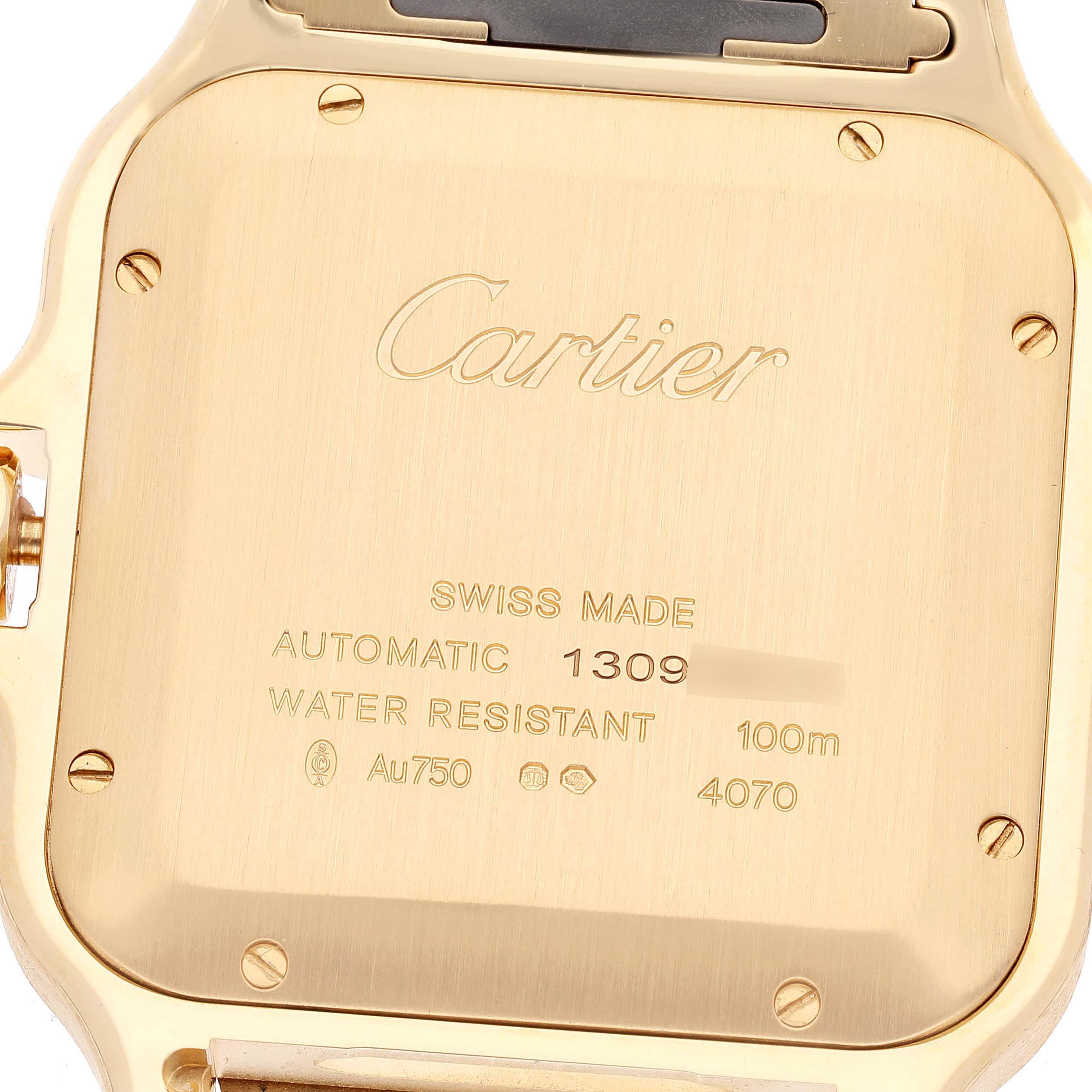 The image shows the case back of a Cartier Santos WGSA029 Men
s Yellow Gold Silver Dial WGSA029 Men
s Yellow Gold Silver Dial watch, displaying engravings and markings.