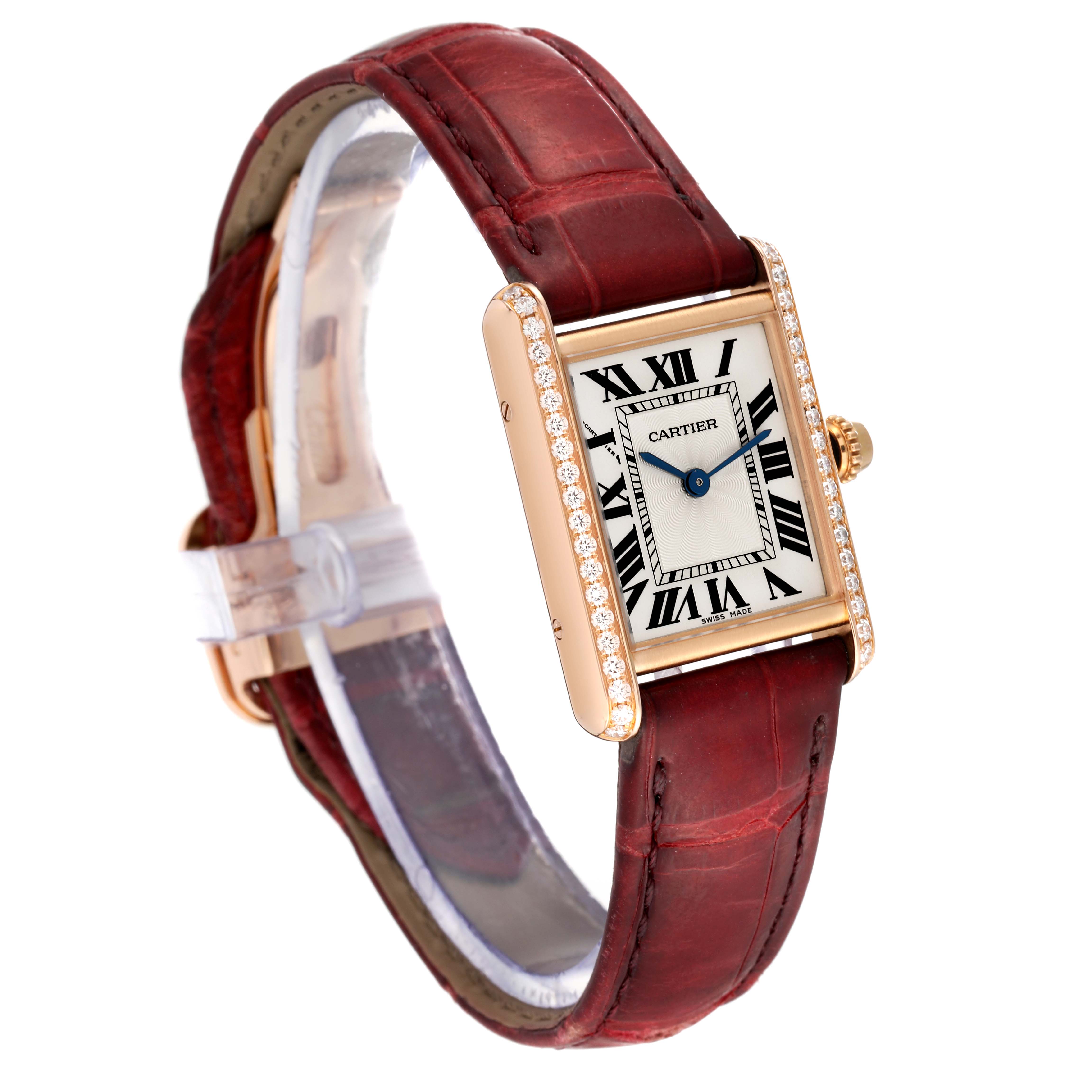 The Cartier Tank Louis WJTA0010 Women
s Rose Gold Silver Dial WJTA0010 Women
s Rose Gold Silver Dial watch is shown at a three-quarter angle, highlighting its rectangular face, diamond bezel, and leather strap.