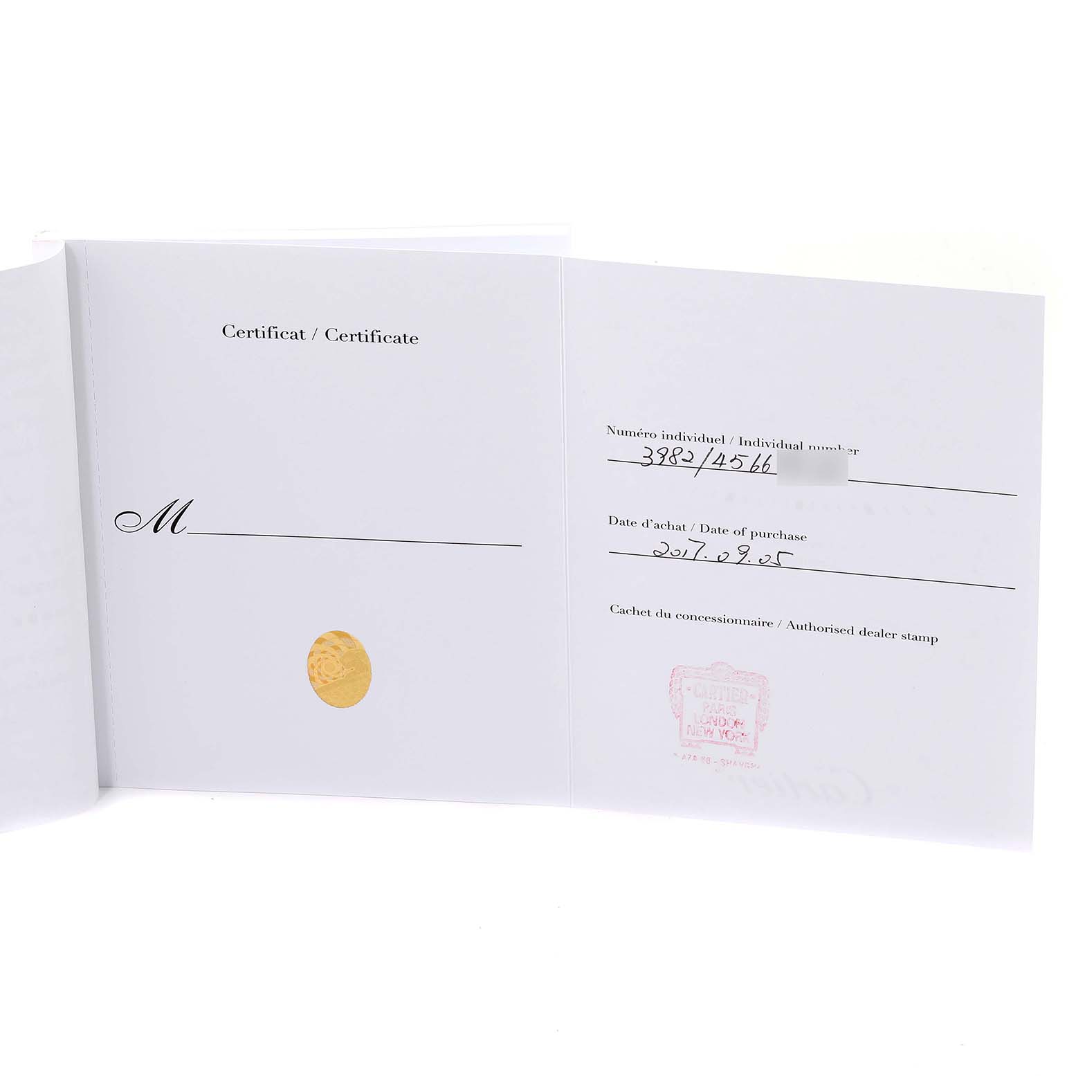 This image shows the certificate and date of purchase for a Cartier Tank Louis WJTA0010 Women
s Rose Gold Silver Dial WJTA0010 Women
s Rose Gold Silver Dial watch, displayed open.