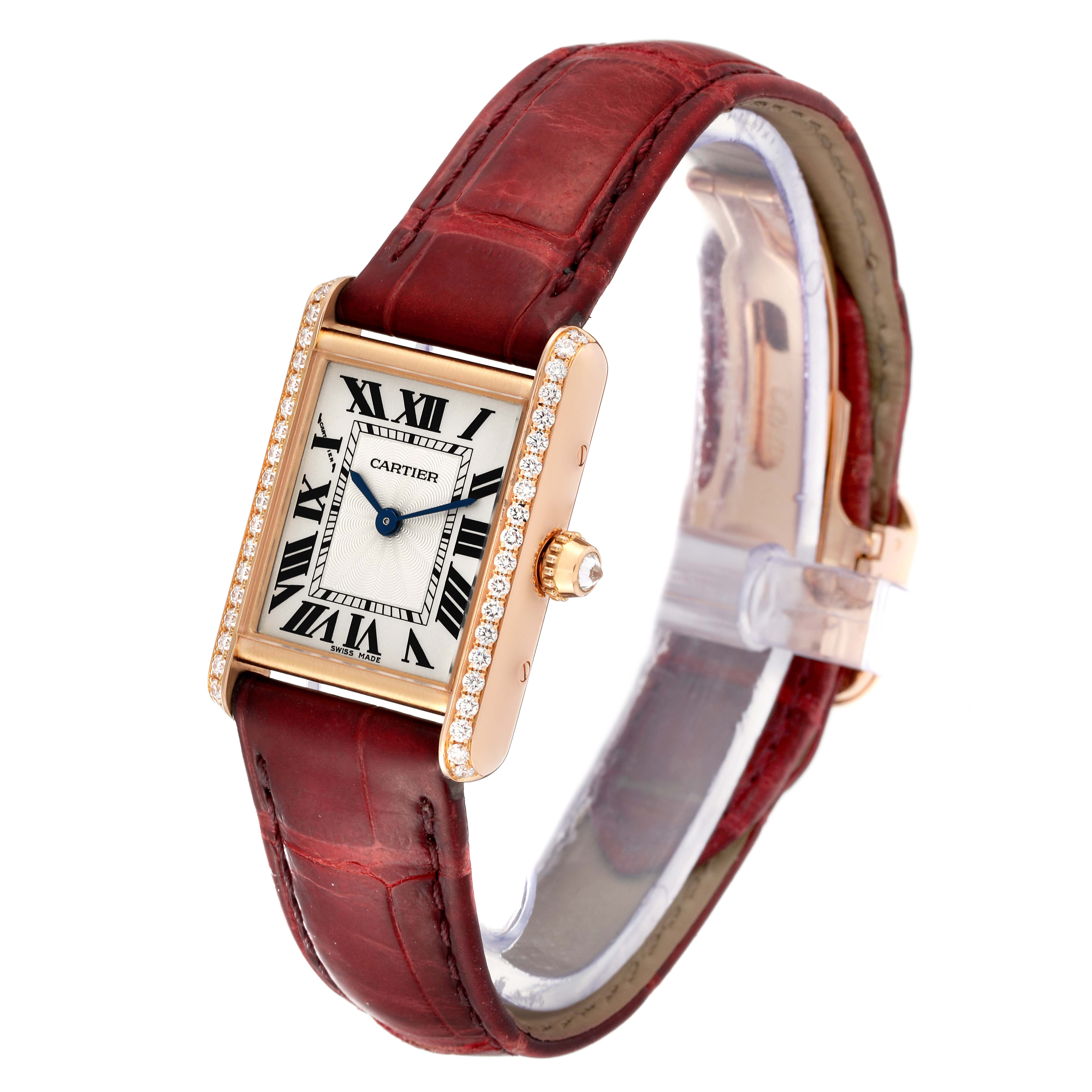 This image shows a Cartier Tank Louis WJTA0010 Women
s Rose Gold Silver Dial WJTA0010 Women
s Rose Gold Silver Dial watch, featuring the face, crown, case, and red leather strap at an angled side view.