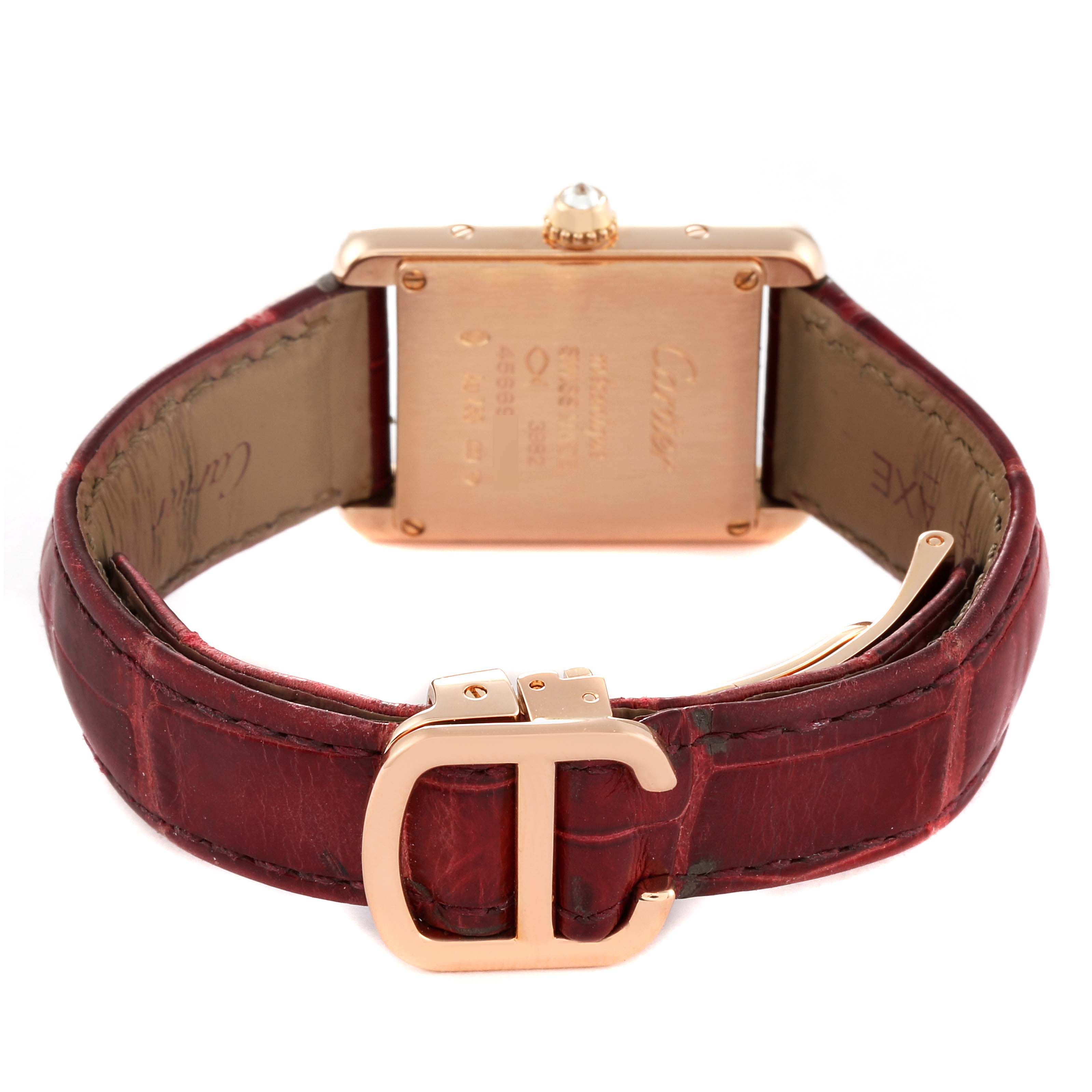 The image shows the back of the Cartier Tank Louis WJTA0010 Women
s Rose Gold Silver Dial WJTA0010 Women
s Rose Gold Silver Dial watch with its leather strap and buckle visible.