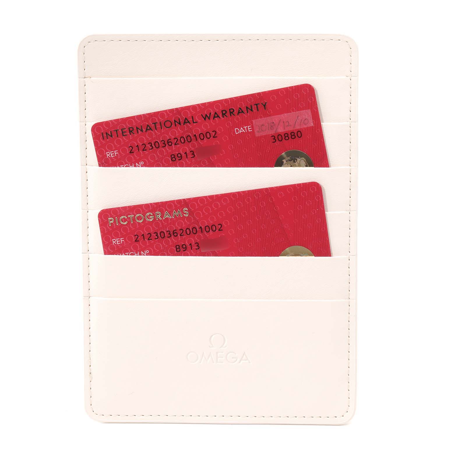 This image shows warranty and pictogram cards for an Omega Seamaster 212.30.36.20.01.002 Men
s Stainless Steel Black Dial 212.30.36.20.01.002 Men
s Stainless Steel Black Dial watch in a light-colored cardholder.