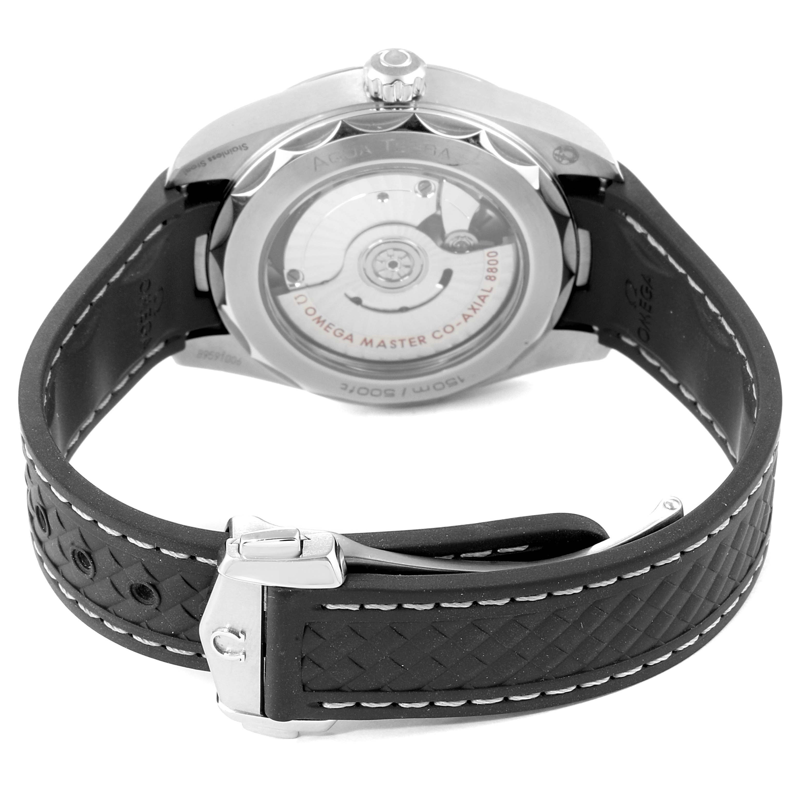 The image shows the back view of an Omega Aqua Terra 220.12.38.20.02.001 Men
s Stainless Steel Silver Dial 220.12.38.20.02.001 Men
s Stainless Steel Silver Dial watch, highlighting its case back and black rubber strap.