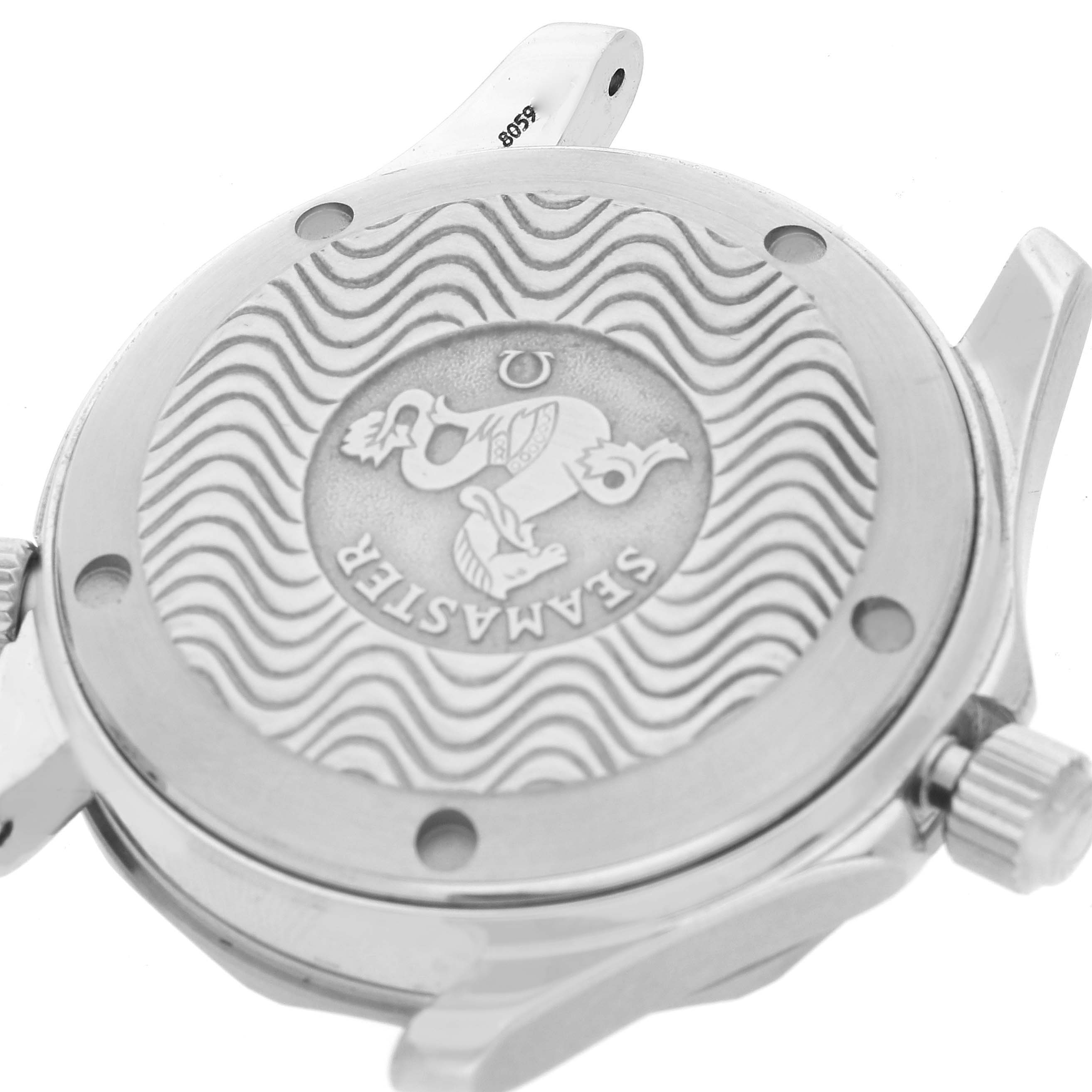 This image shows the case back of the Omega Seamaster 2551.80.00 Men's Stainless Steel Blue Dial 2551.80.00 Men's Stainless Steel Blue Dial watch, featuring its engraved logo and wavy pattern design.