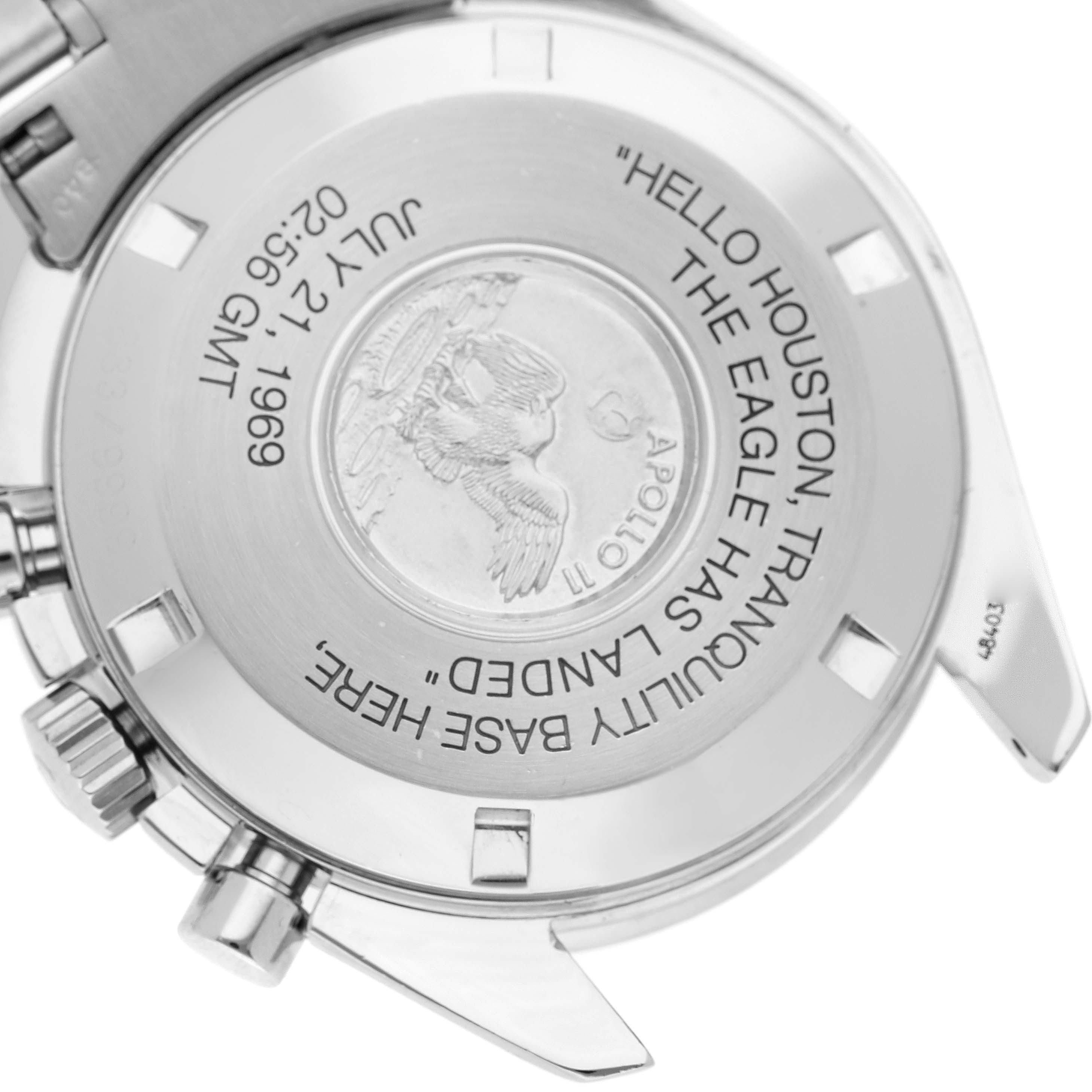 This is the back of an Omega Speedmaster 3560.50.00 Men's Stainless Steel Black Dial 3560.50.00 Men's Stainless Steel Black Dial watch, showing the case back with an engraving commemorating the Apollo 11 mission.