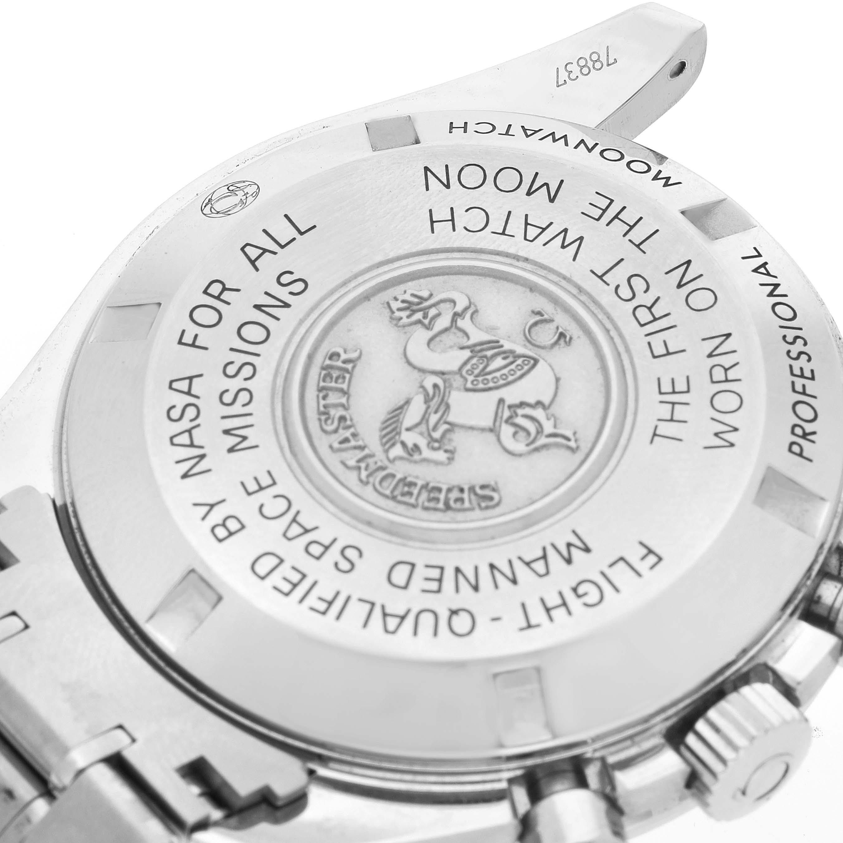 The image shows the back case of an Omega Speedmaster 311.30.42.30.01.005 Men's Stainless Steel Black Dial 311.30.42.30.01.005 Men's Stainless Steel Black Dial watch with engraved text detailing its achievements and specifications.