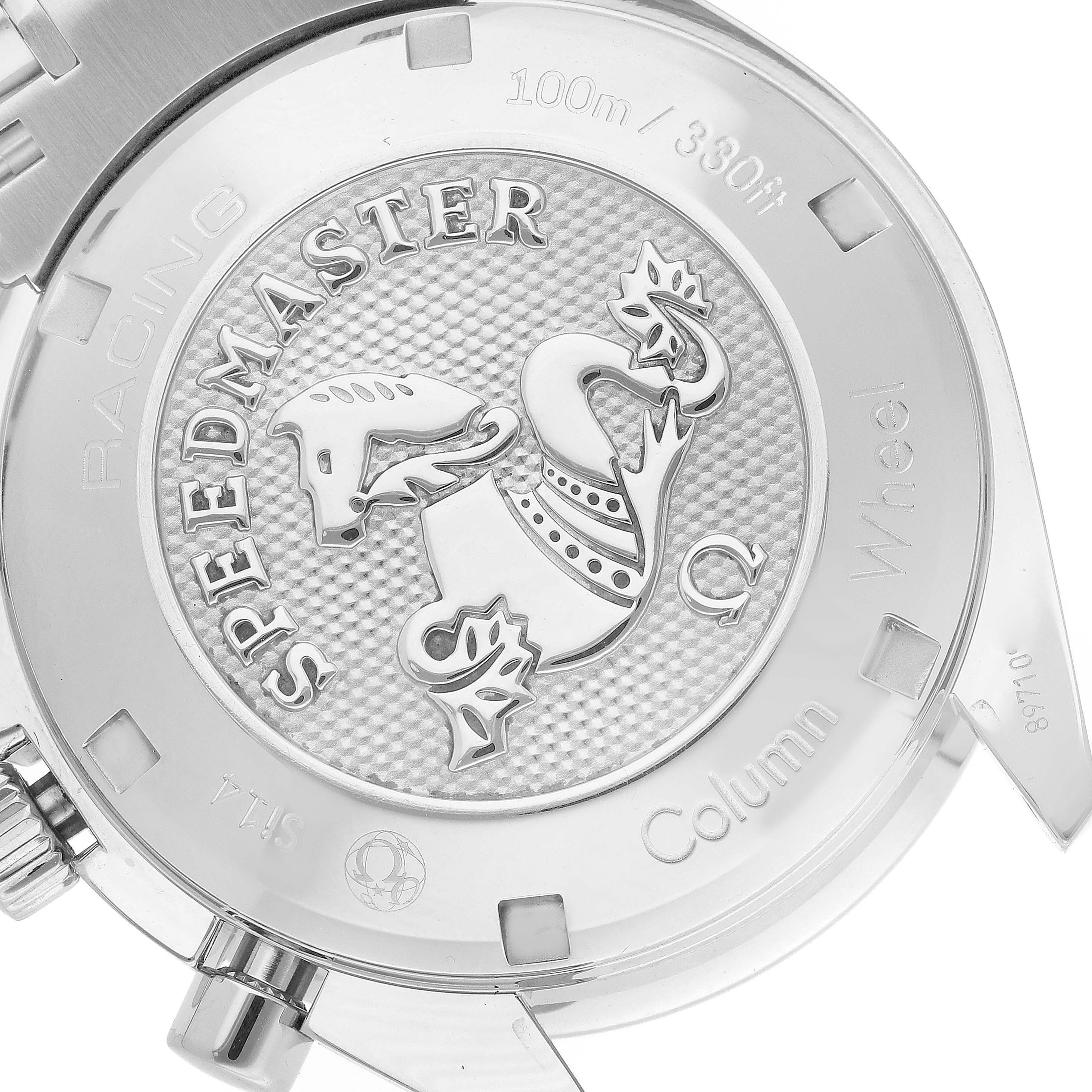 The image shows a close-up of the case back of an Omega Speedmaster 326.30.40.50.11.001 Men
s Stainless Steel Red Dial 326.30.40.50.11.001 Men
s Stainless Steel Red Dial watch featuring an engraved emblem and text.