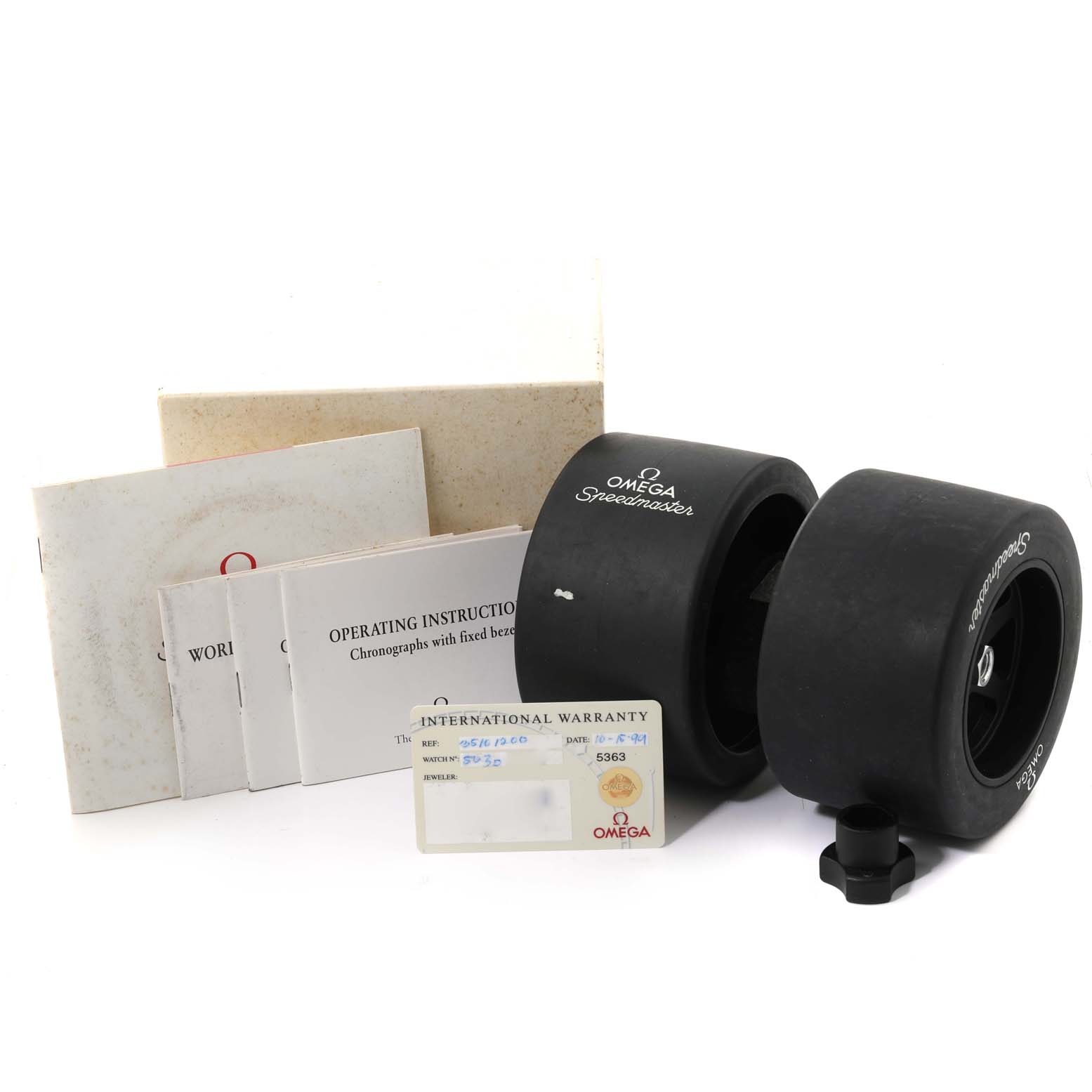 The image shows the packaging, warranty card, and instruction manuals for the Omega Speedmaster 3510.12.00 Men's Stainless Steel Yellow Dial 3510.12.00 Men's Stainless Steel Yellow Dial watch.