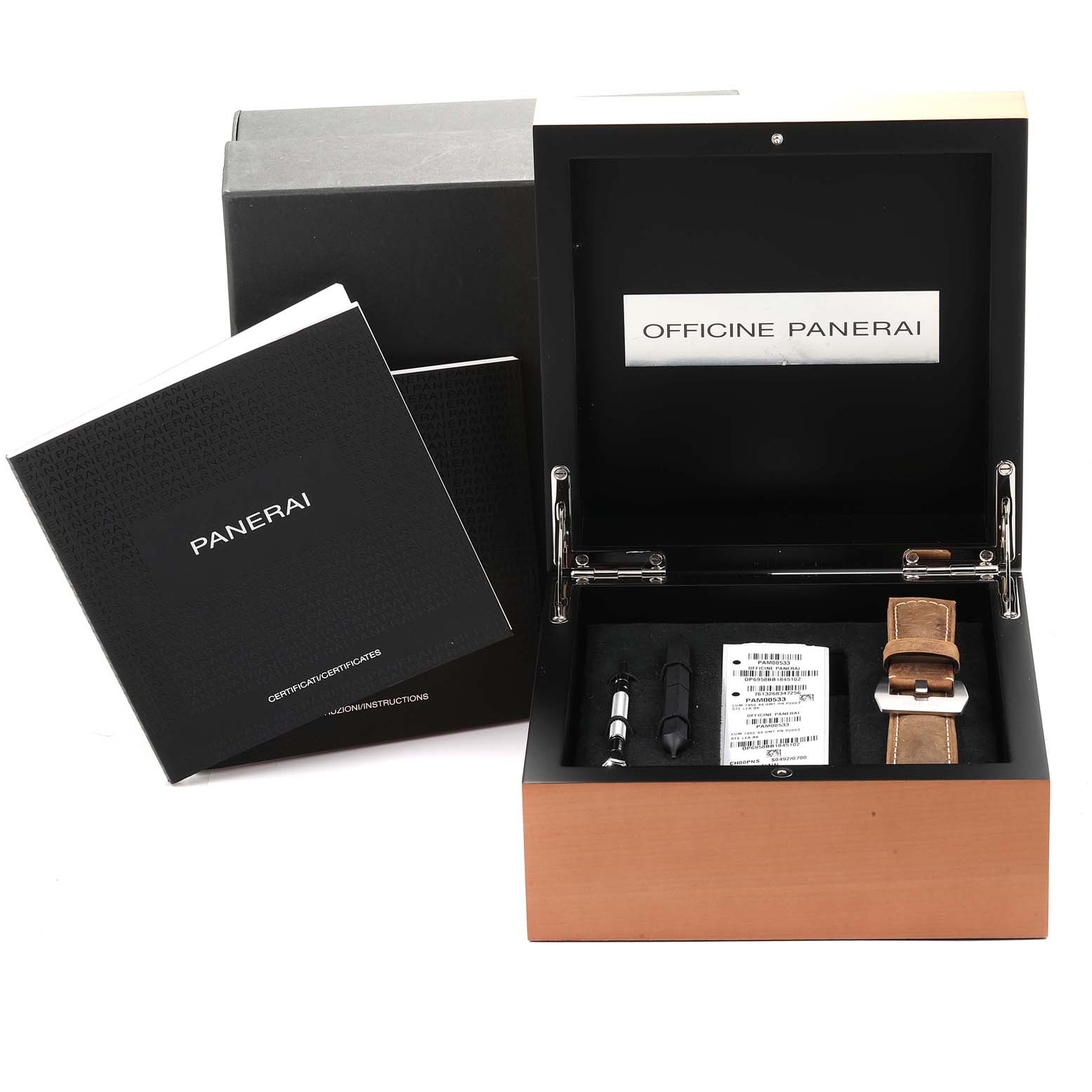 The image shows a Panerai Luminor PAM00533 Men
s Stainless Steel Black Dial PAM00533 Men
s Stainless Steel Black Dial watch set, including a carrying box, strap tool, spare strap, and instruction manuals.
