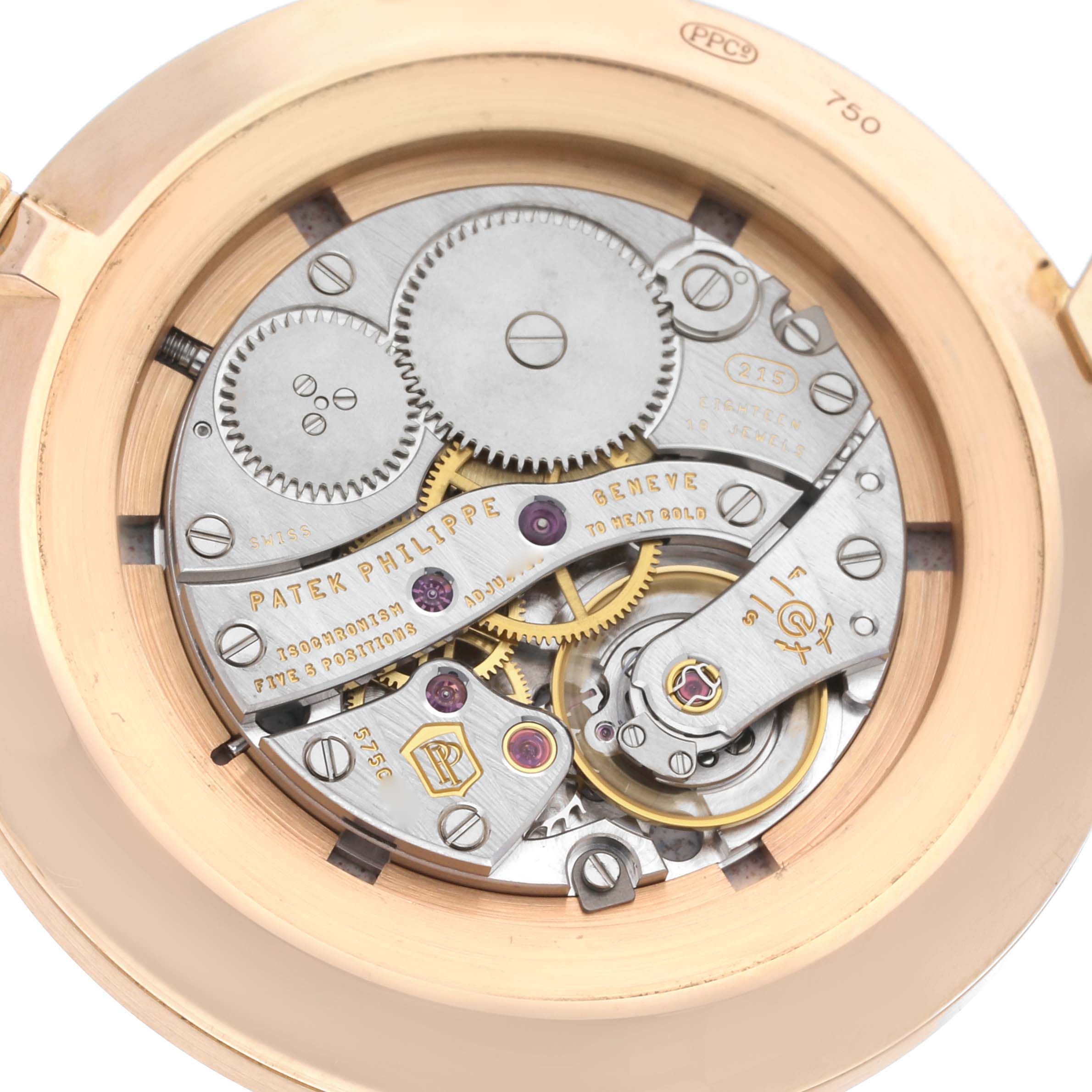 This image shows the intricate internal mechanism of a Patek Philippe Calatrava 5116R Men's Rose Gold White Dial 5116R Men's Rose Gold White Dial watch at a close-up angle.