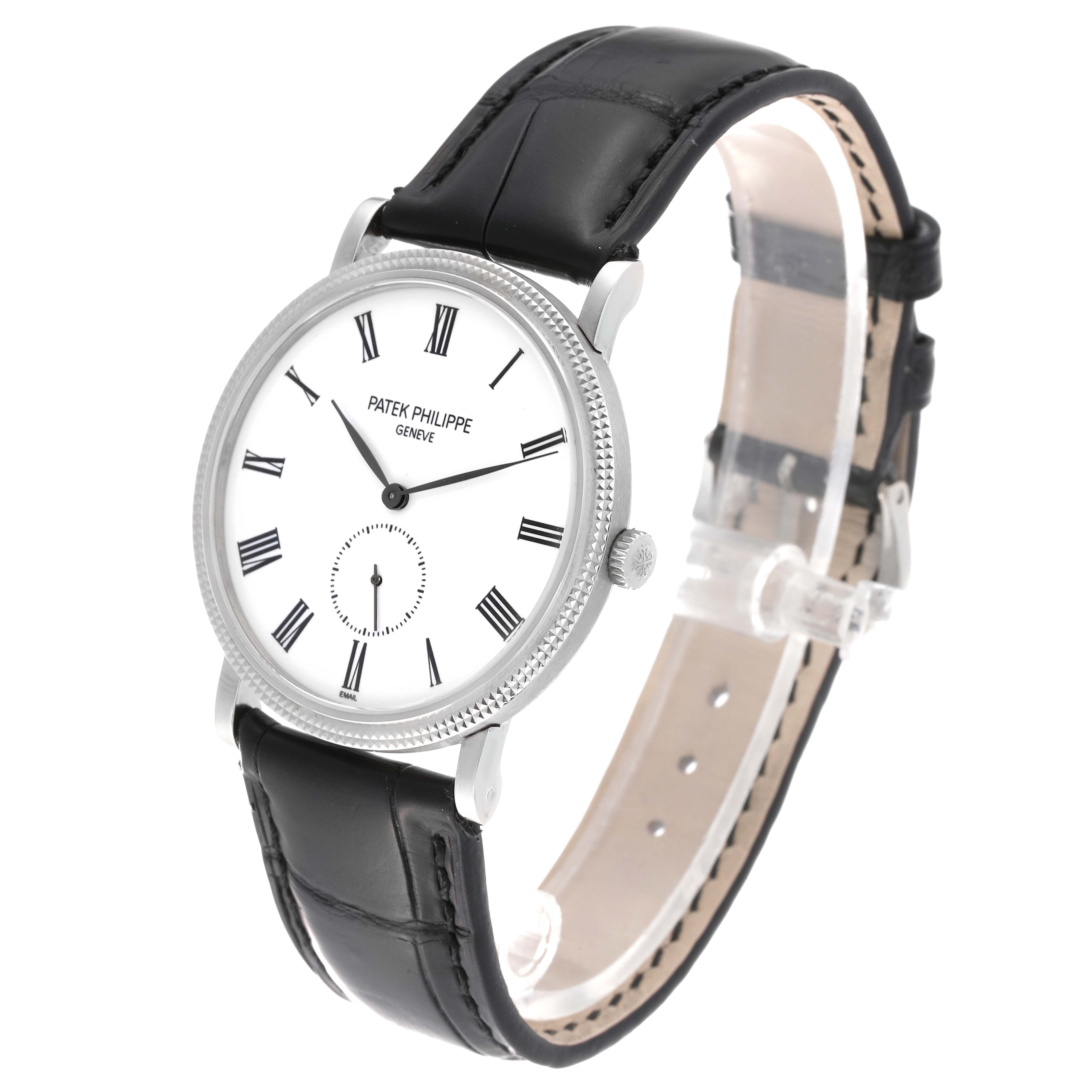 The image shows a Patek Philippe Calatrava 5116G Men
s White Gold White Dial 5116G Men
s White Gold White Dial model watch at an angled side view, displaying the face, strap, bezel, and crown.