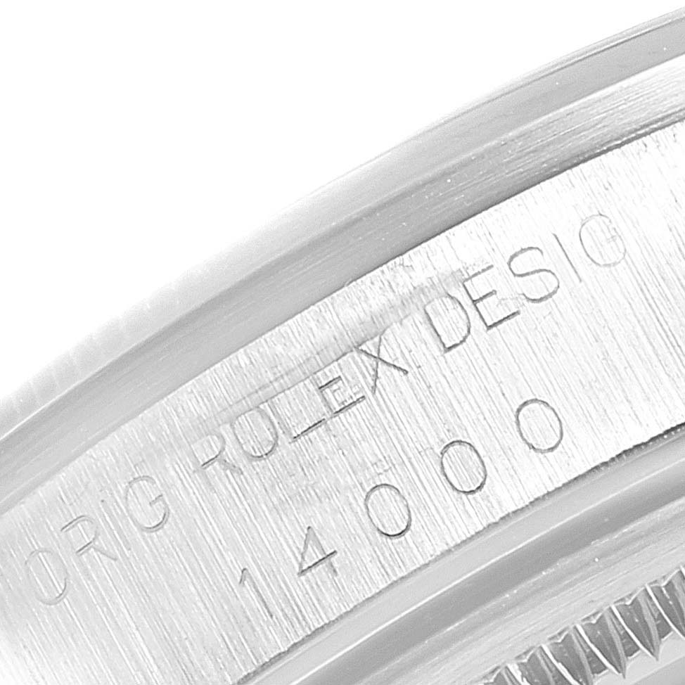 This close-up image shows the engraved serial number on the inner bezel of a Rolex Air-King 14000 Men's Stainless Steel Pink Dial 14000 Men's Stainless Steel Pink Dial watch.