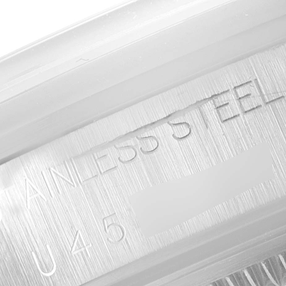 This image shows a close-up of the engraving on the stainless steel back of a Rolex Air-King 14000 Men's Stainless Steel Pink Dial 14000 Men's Stainless Steel Pink Dial watch.