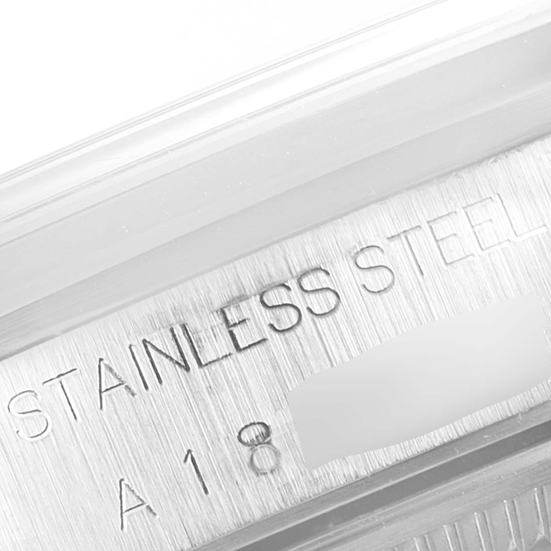 The image shows a close-up of the stainless steel case back of a Rolex Air-King 14000 Men's Stainless Steel Pink Dial 14000 Men's Stainless Steel Pink Dial watch.