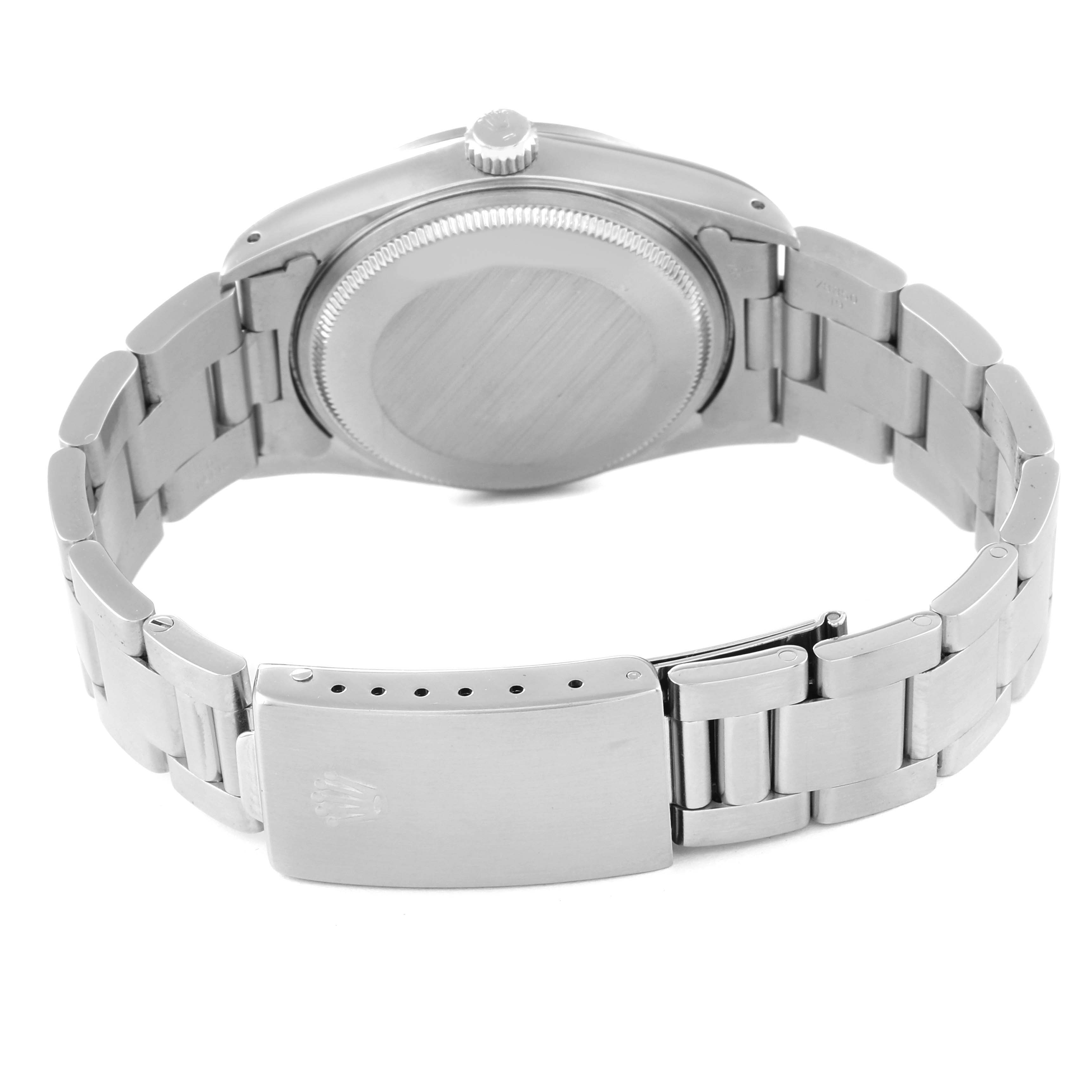 This image shows the backside view of a Rolex Air-King 14000 Men's Stainless Steel Silver Dial 14000 Men's Stainless Steel Silver Dial watch, including the case back, crown, and bracelet with the clasp.