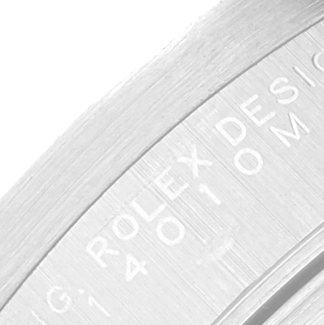 This close-up image of the Rolex Air-King 14010 Men's Stainless Steel Silver Dial 14010 Men's Stainless Steel Silver Dial watch shows part of the engraved bezel or caseback.