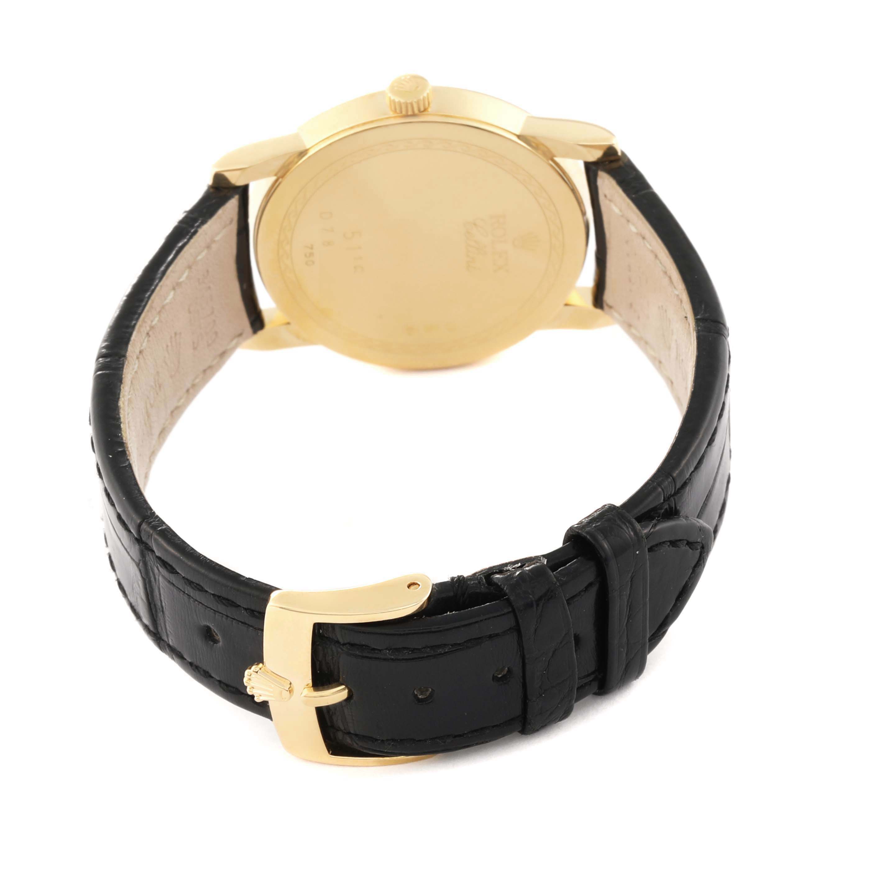 The image shows the back view of a Rolex Cellini 5116/8 Men's Yellow Gold Silver Dial 5116/8 Men's Yellow Gold Silver Dial watch, highlighting the case back, crown, and leather strap with a buckle.