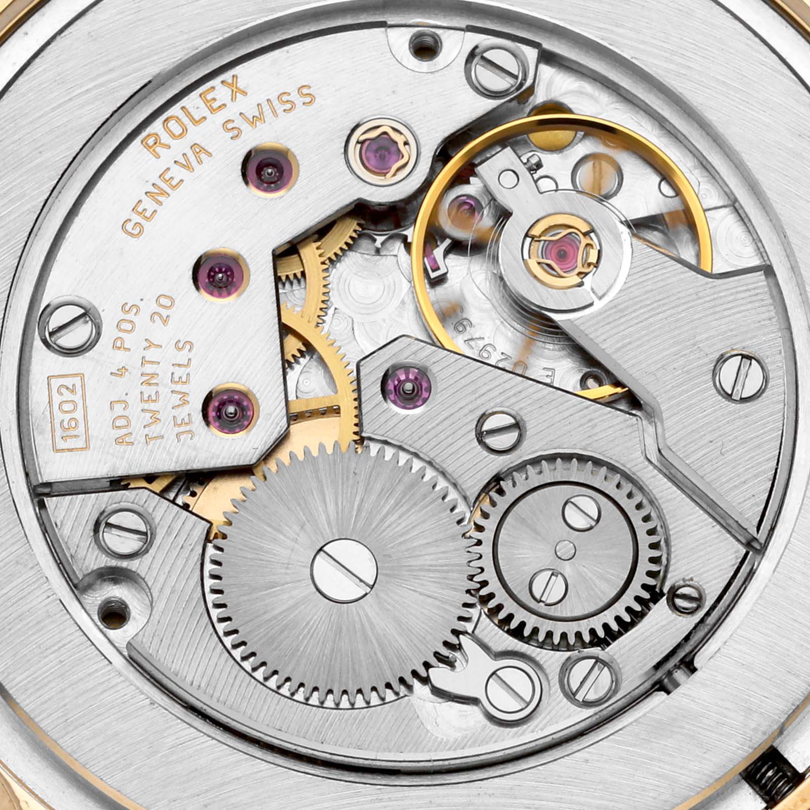 This image shows a close-up of the movement mechanism of a Rolex Cellini 5116/8 Men's Yellow Gold Silver Dial 5116/8 Men's Yellow Gold Silver Dial watch, highlighting gears and jewels.