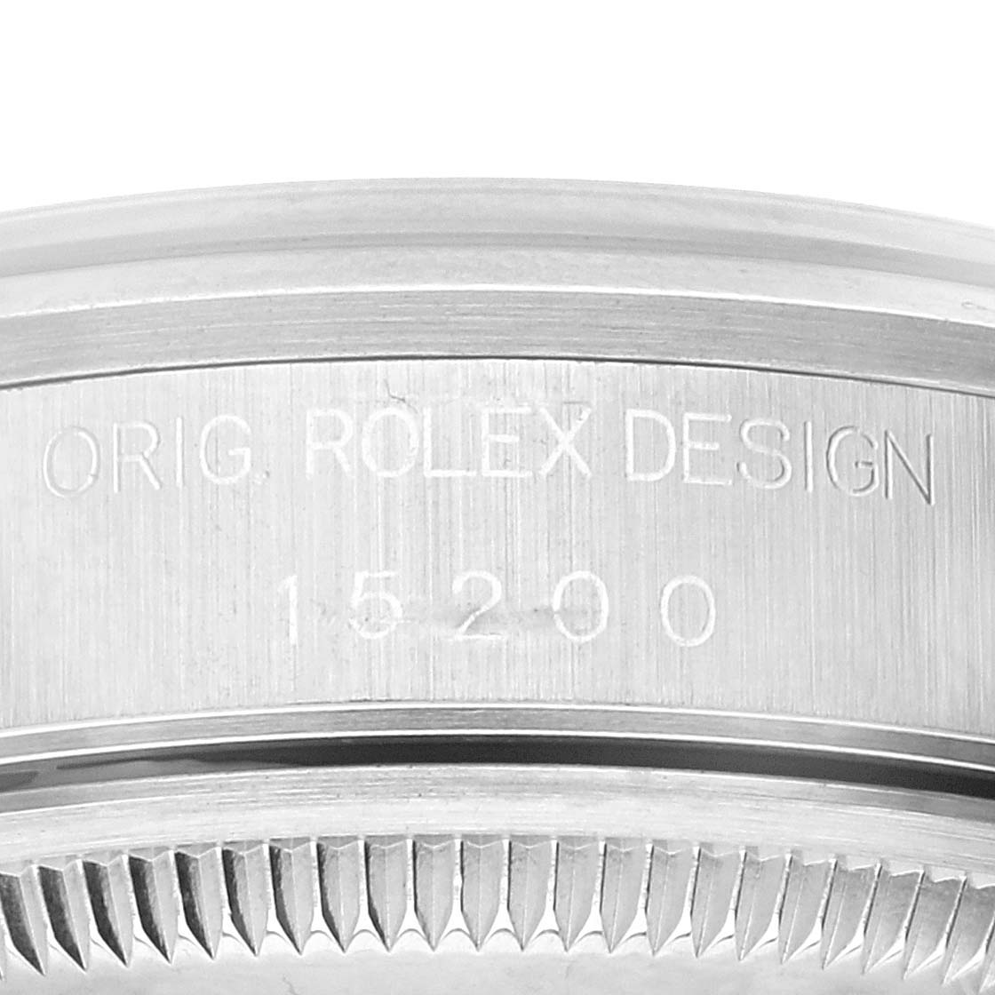This is a close-up view of the case engraved with "Orig. Rolex Design 15200" on a Rolex Date 15200 Men's Stainless Steel Black Dial 15200 Men's Stainless Steel Black Dial model watch.