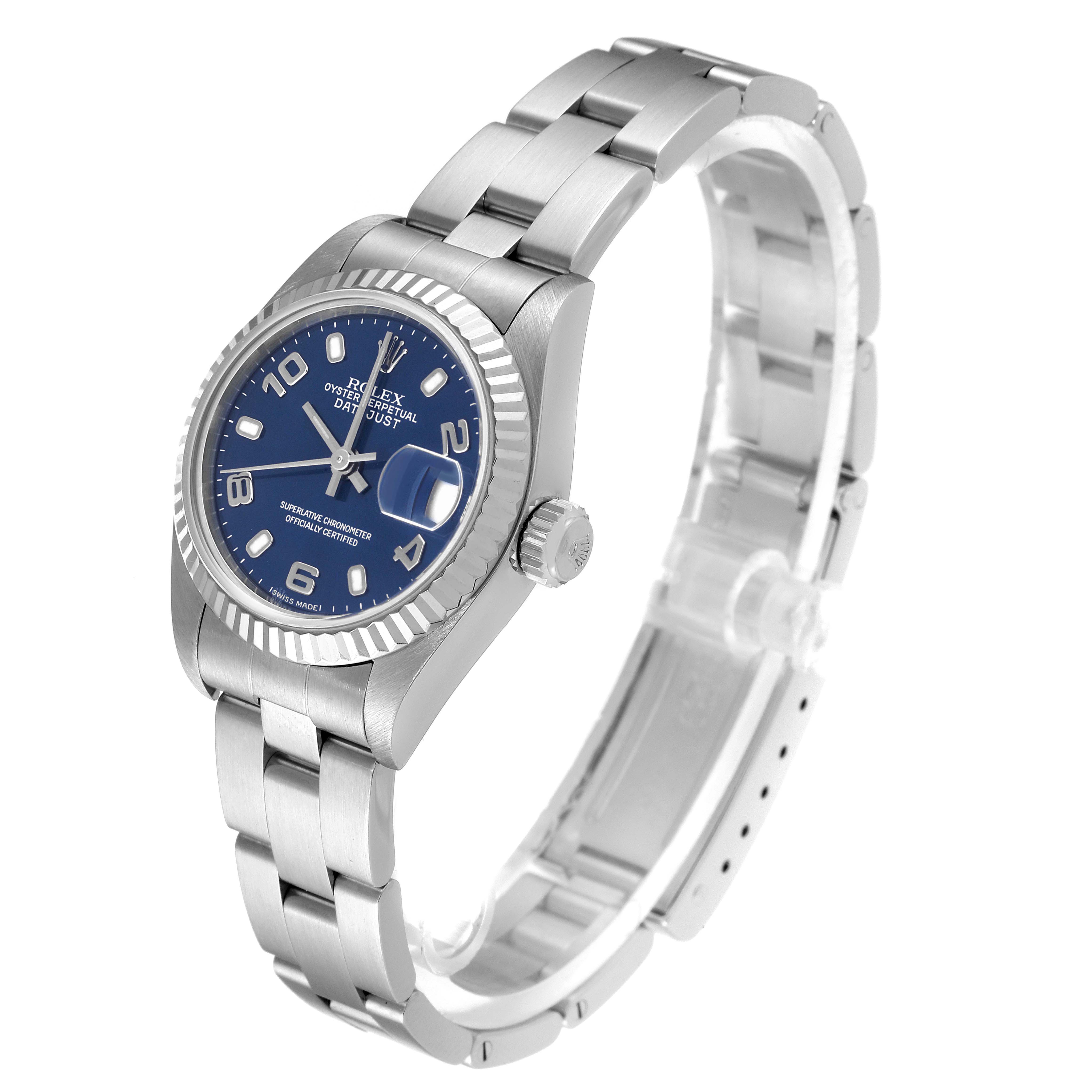The Rolex Datejust 79174 Women's Stainless Steel Blue Dial 79174 Women's Stainless Steel Blue Dial model watch is shown at a tilted angle, displaying the face, bezel, crown, and part of the bracelet.