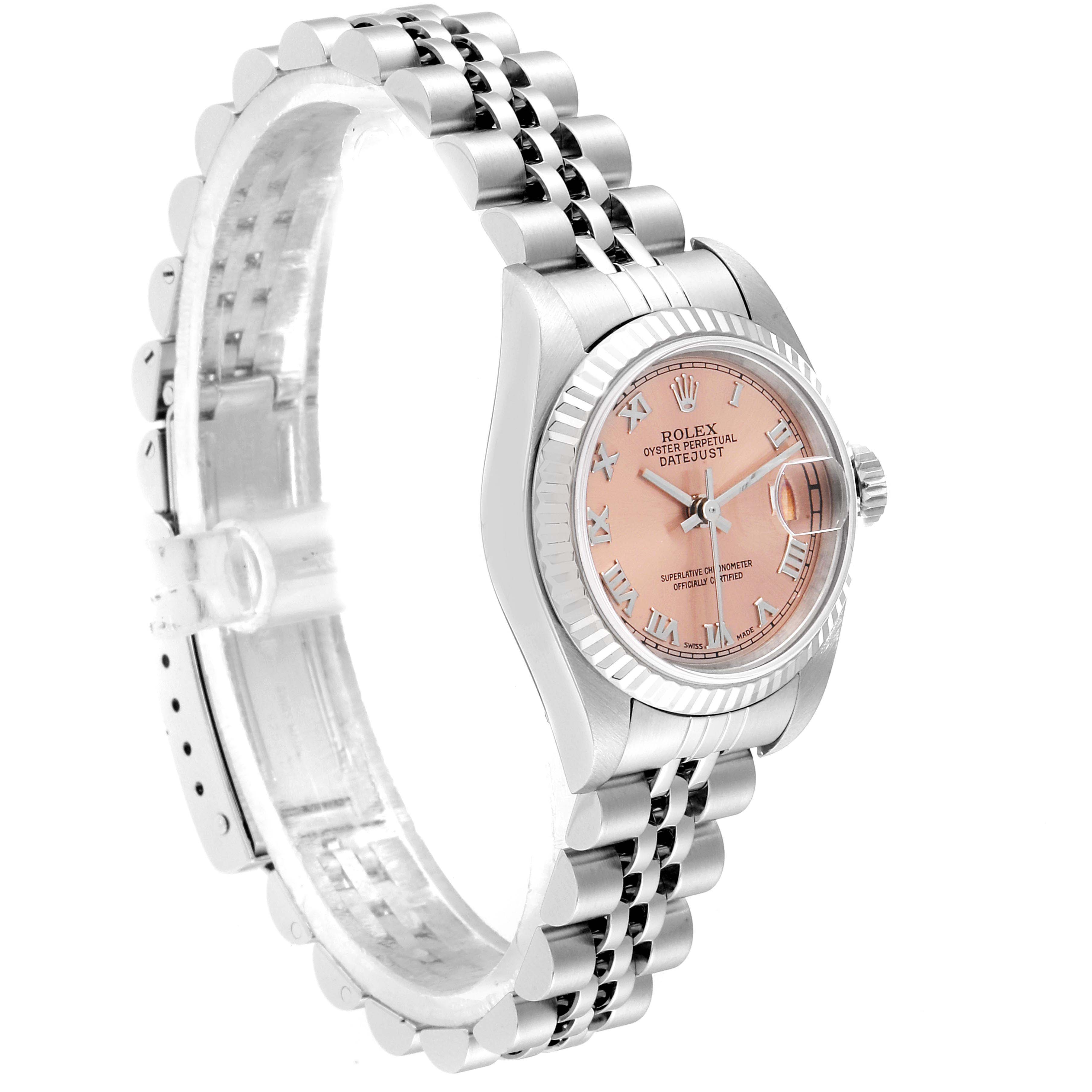 This image shows a Rolex Datejust 79174 Women's Stainless Steel Pink Dial 79174 Women's Stainless Steel Pink Dial watch from a slight side angle, highlighting the dial, bezel, and bracelet.