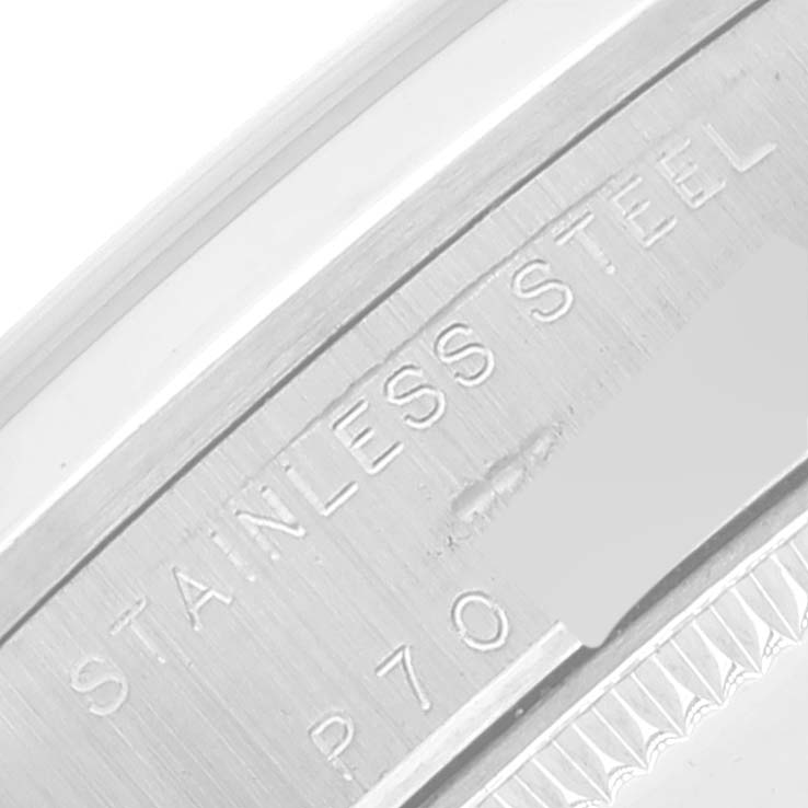 This image shows a close-up of the case, describing the "STAINLESS STEEL" composition of the Mid-Size Rolex watch.