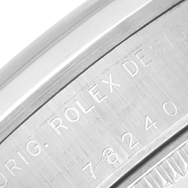 The image shows a close-up of the case side engraving on a Rolex Mid-Size 78240 Women
s Stainless Steel White Dial 78240 Women
s Stainless Steel White Dial watch.