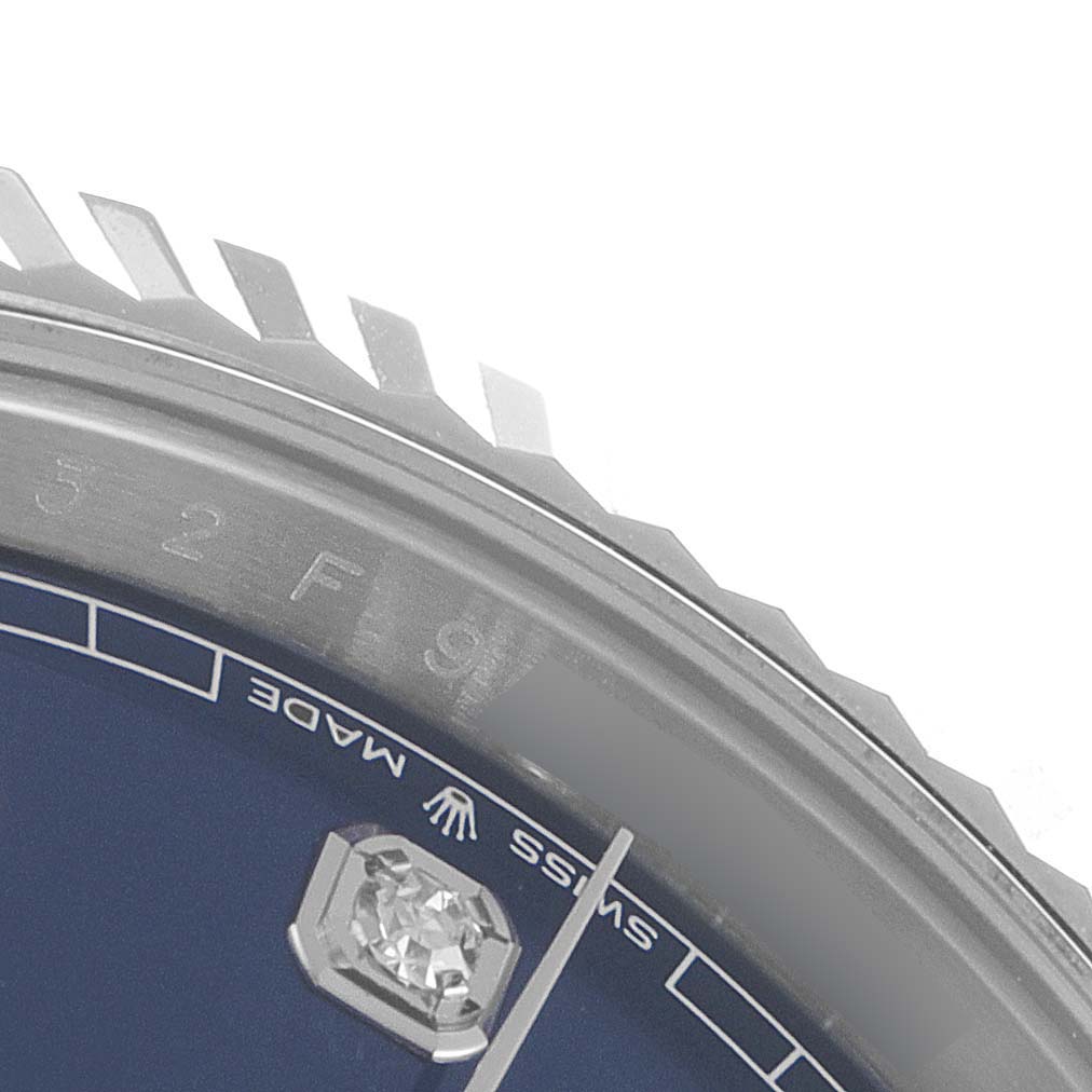 The image shows a close-up of the dial and bezel of a Rolex Datejust 41 126334 Men's Stainless Steel Blue Dial 126334 Men's Stainless Steel Blue Dial, highlighting the "SWISS MADE" marking and diamond.