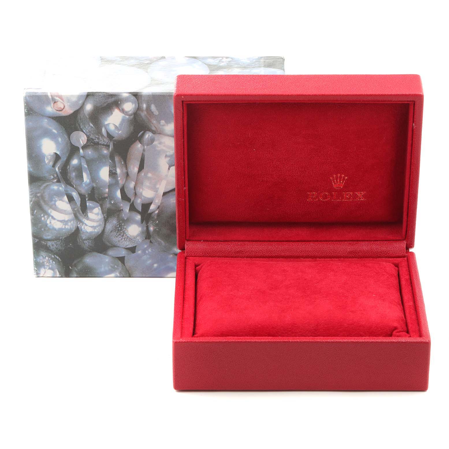 The image shows the opened red velvet box for a Rolex Datejust 79174 Women
s Stainless Steel Mother of Pearl Dial 79174 Women
s Stainless Steel Mother of Pearl Dial watch, with the outer decorative box in the background.