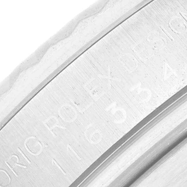 This close-up image shows the side engraving of the case from a Rolex Datejust 41 116334 Men
s Stainless Steel Blue Dial 116334 Men
s Stainless Steel Blue Dial model.
