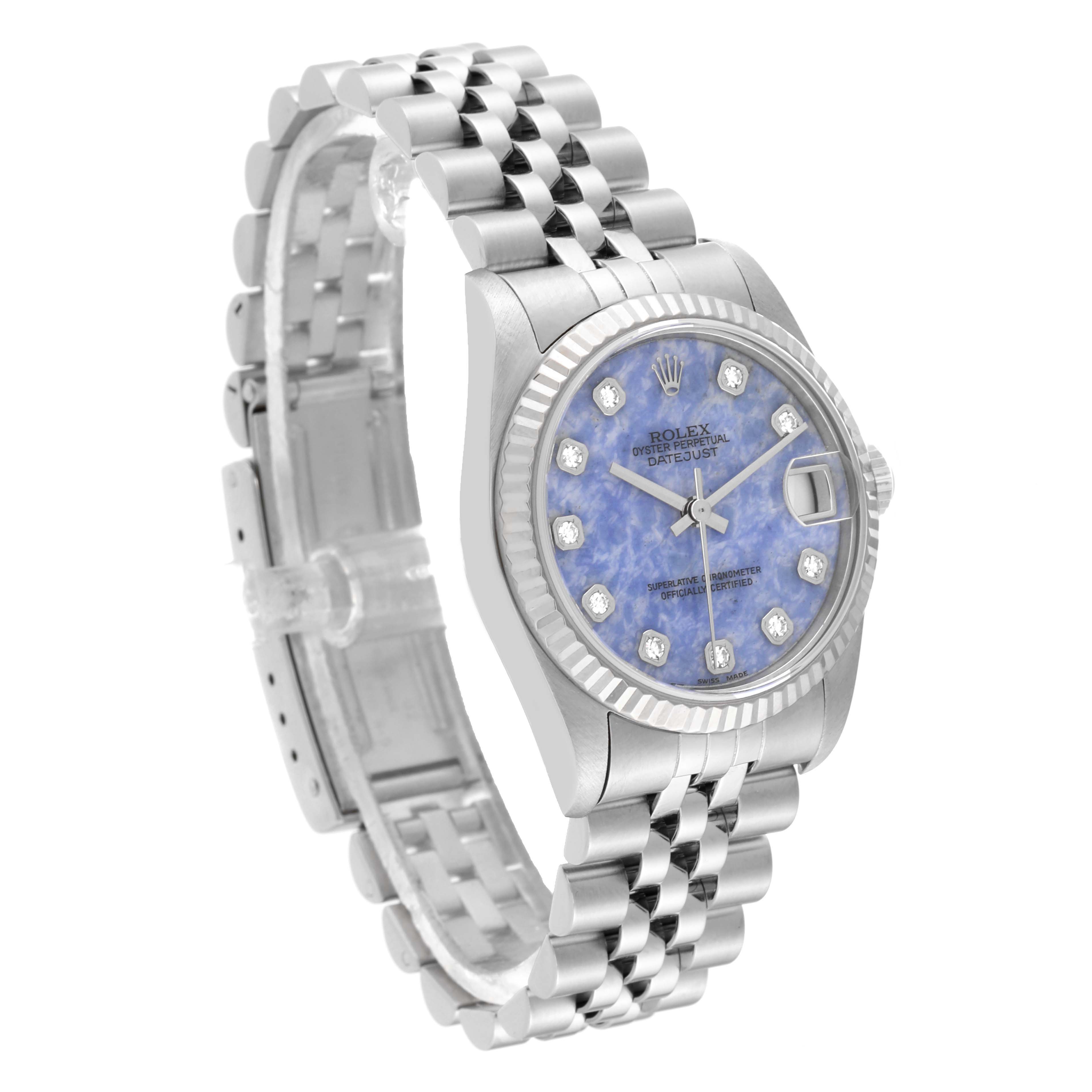 This Rolex Mid-Size 68274 Women's Stainless Steel Blue Dial 68274 Women's Stainless Steel Blue Dial model watch is shown at an angle displaying its face, bezel, and bracelet.