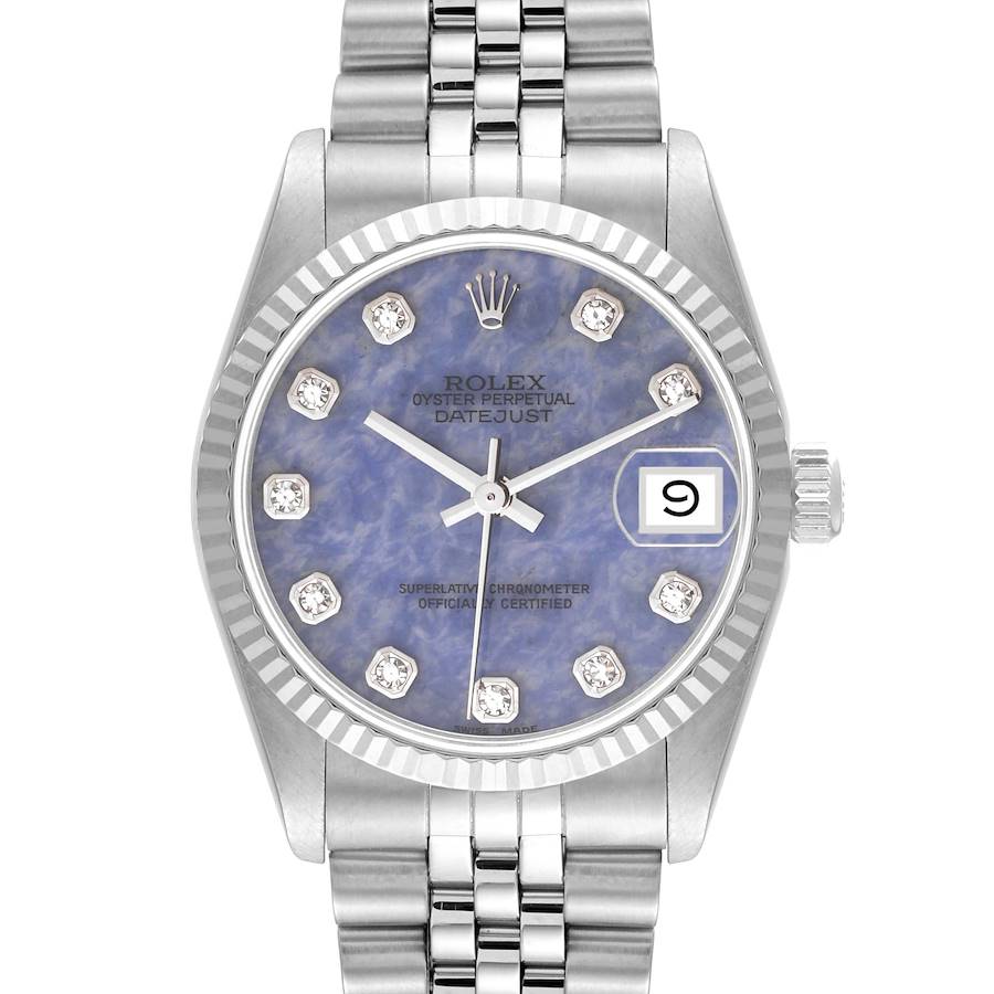 The Rolex Mid-Size Datejust watch is shown from a straight-on angle, displaying its blue dial, date window, and metal bracelet.