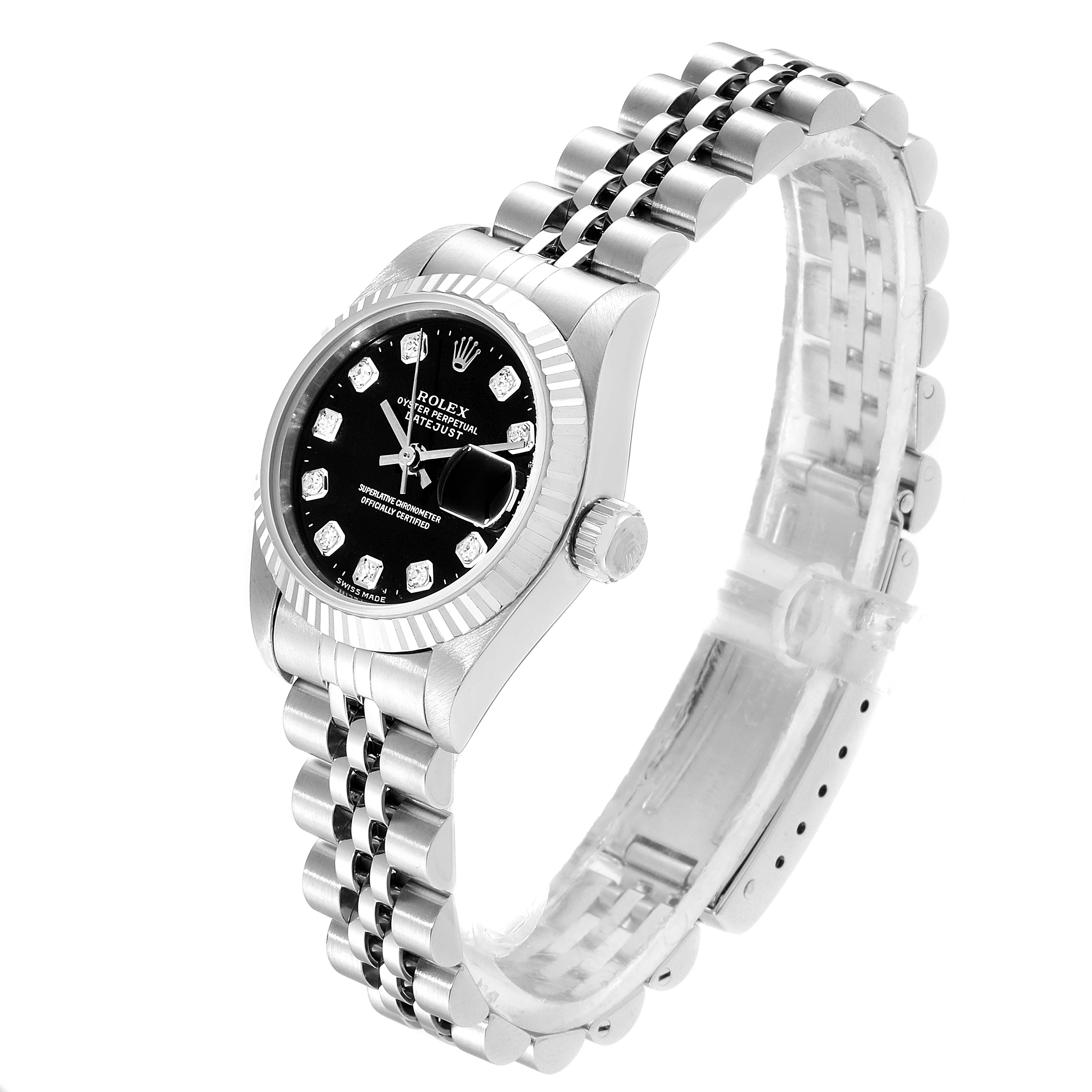 The image shows a Rolex Datejust 69174 Women
s Stainless Steel Black Dial 69174 Women
s Stainless Steel Black Dial watch from a three-quarter angle, featuring its Jubilee bracelet, fluted bezel, and black dial with diamond hour markers.