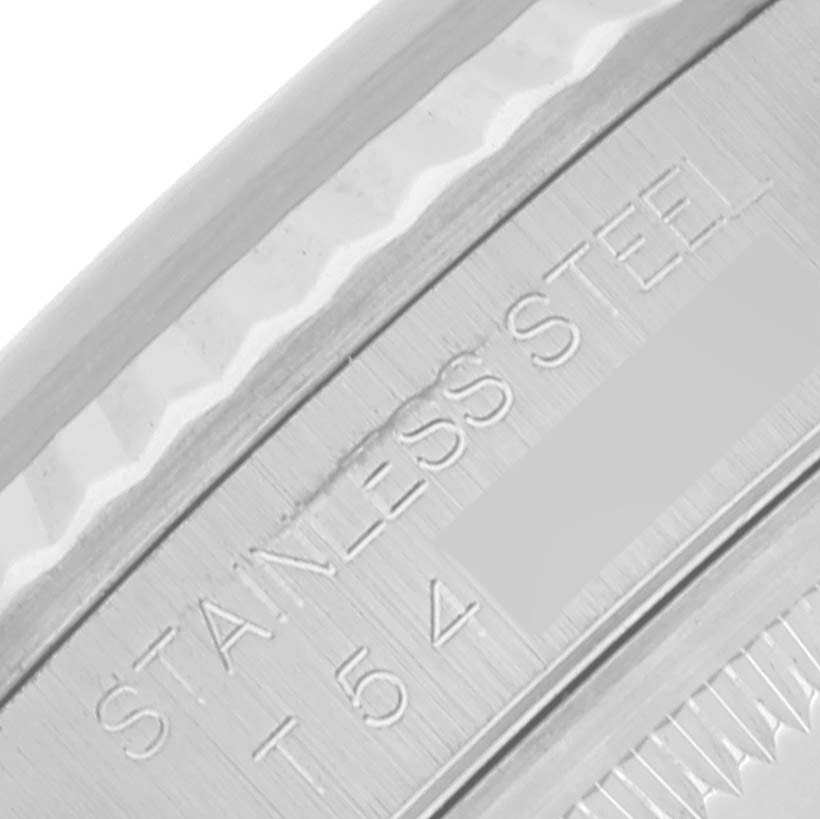 The image shows a close-up angle of the outer rim and bezel of a Rolex Datejust 16234 Men's Stainless Steel Black Dial 16234 Men's Stainless Steel Black Dial watch, highlighting the "STAINLESS STEEL" engraving.