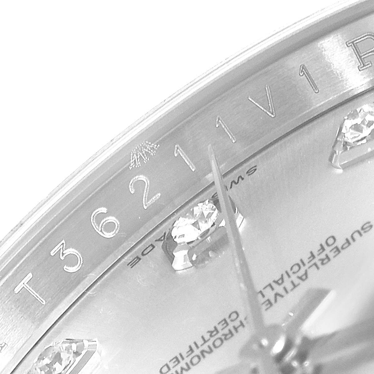 Close-up of the dial and minute markers of a Rolex Datejust 116234  Men's Stainless Steel Silver Dial 116234  Men's Stainless Steel Silver Dial watch, showing diamond hour markers and "SWISS MADE" text.