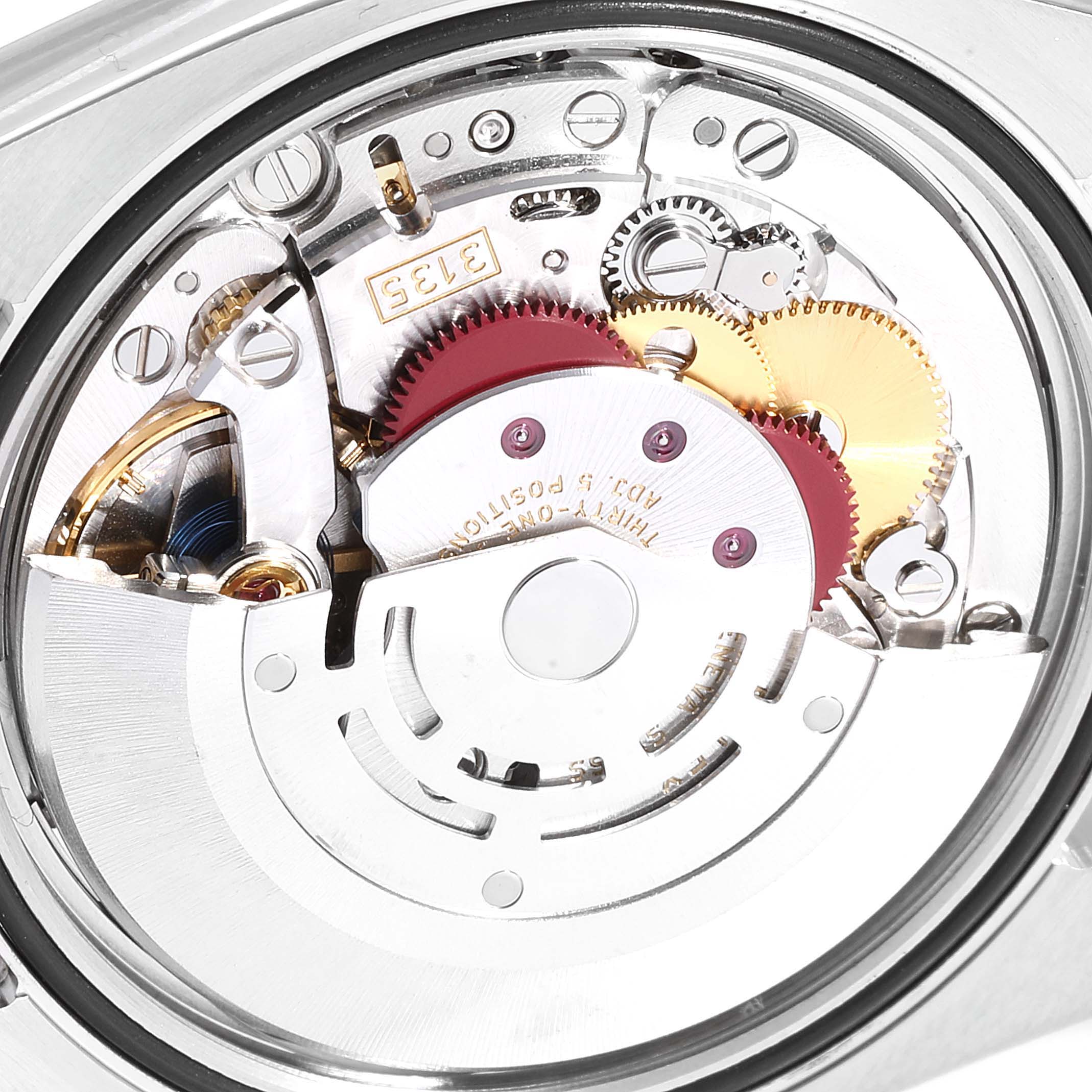 This image shows a close-up of the movement mechanism inside a Rolex Datejust 116234  Men's Stainless Steel Silver Dial 116234  Men's Stainless Steel Silver Dial watch, highlighting the gears and components.