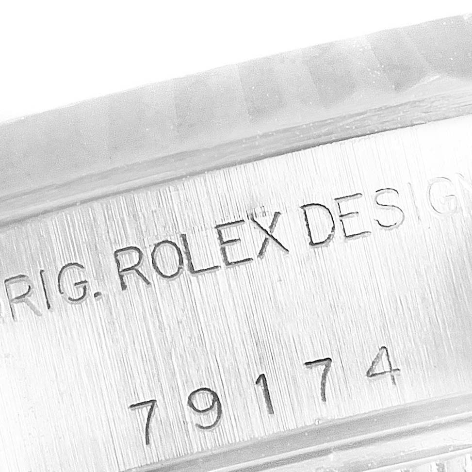 This image shows a close-up of the engraved model number 79174 on the side of a Rolex Datejust 79174 Women's Steel and Gold (two tone) White Dial 79174 Women's Steel and Gold (two tone) White Dial watch case.
