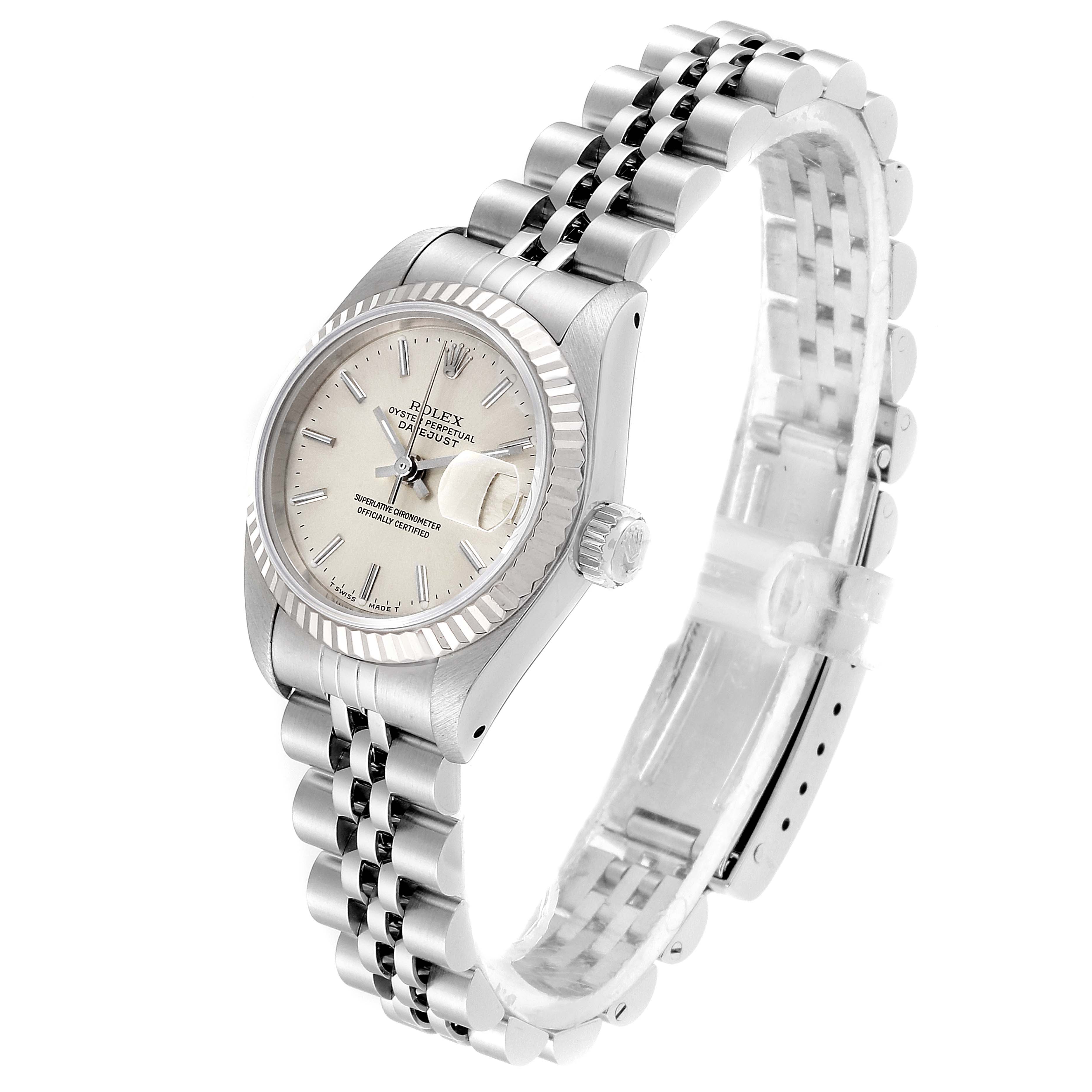 This Rolex Datejust 69174 Women
s Stainless Steel Silver Dial 69174 Women
s Stainless Steel Silver Dial watch is pictured at an angled view showing the face, fluted bezel, and Jubilee bracelet.