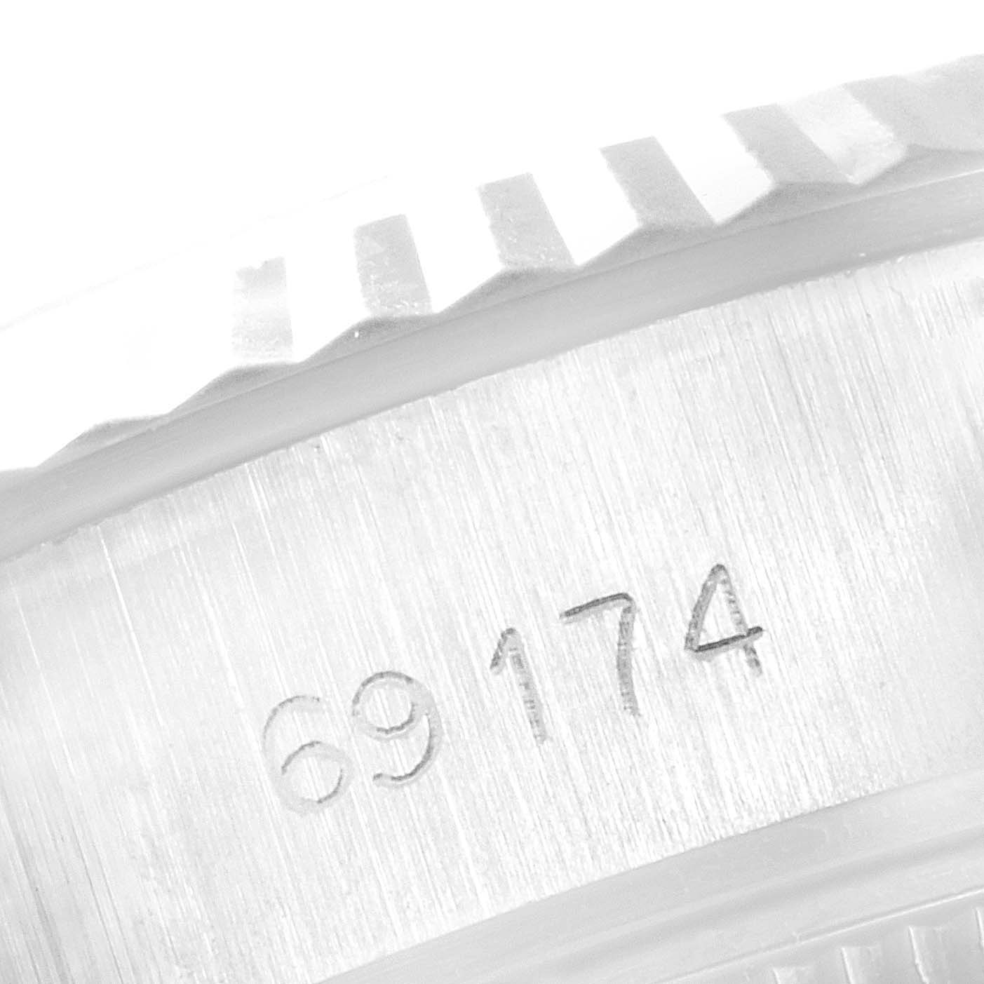 This close-up image shows the model number "69174" engraved on the side of a Rolex Datejust 69174 Women
s Stainless Steel Silver Dial 69174 Women
s Stainless Steel Silver Dial watch case.