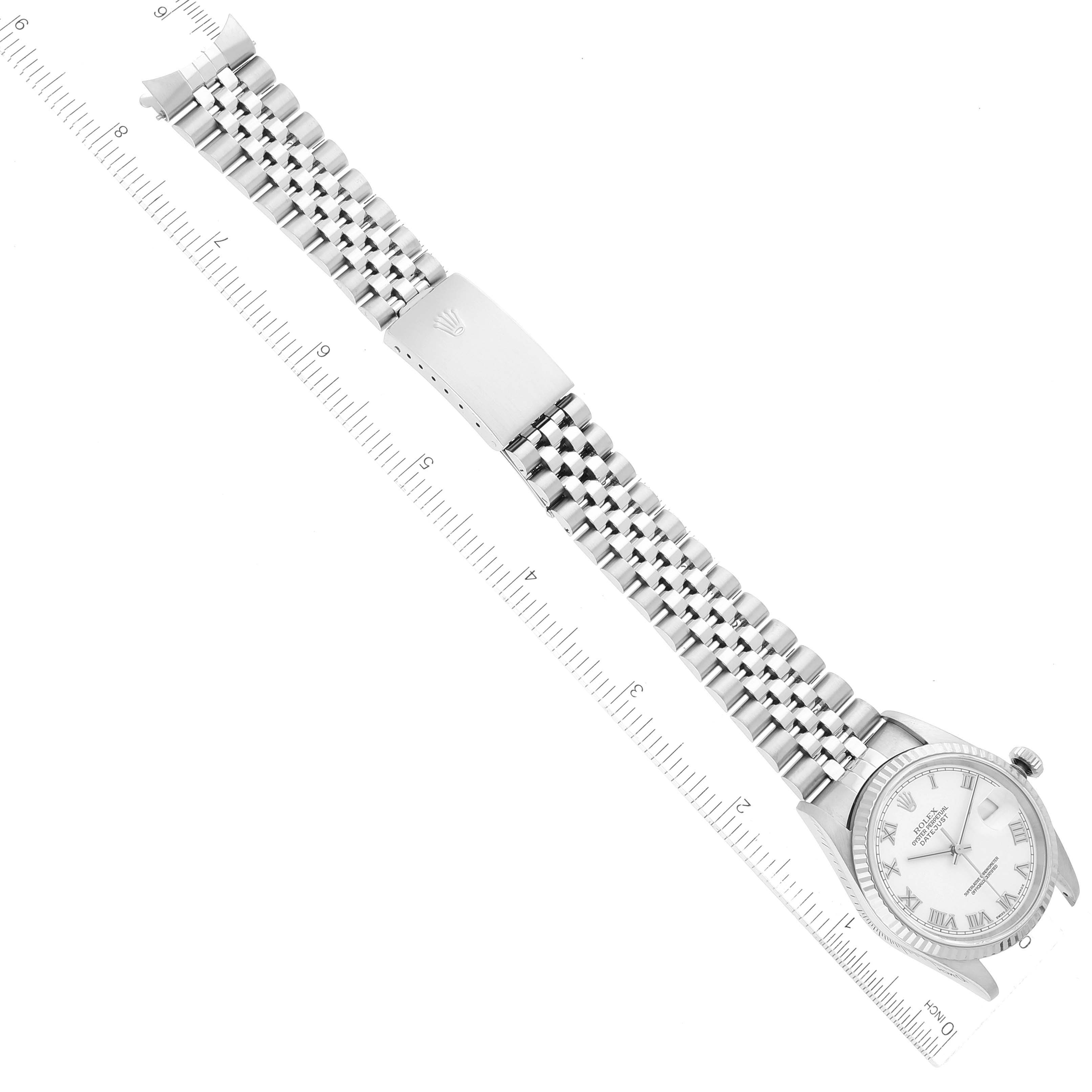 The image shows a Rolex Datejust 16234 Men's Stainless Steel White Dial 16234 Men's Stainless Steel White Dial watch laid flat with a ruler for size reference, displaying the face and bracelet.