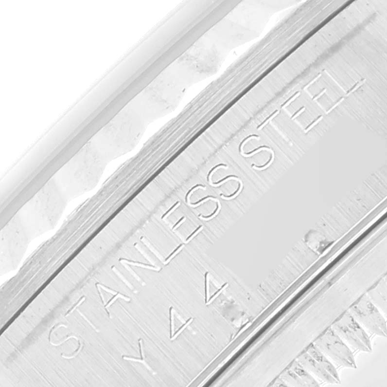 The image shows a close-up shot of the casing with engraved text on a Rolex Datejust 16234 Men's Stainless Steel White Dial 16234 Men's Stainless Steel White Dial watch.