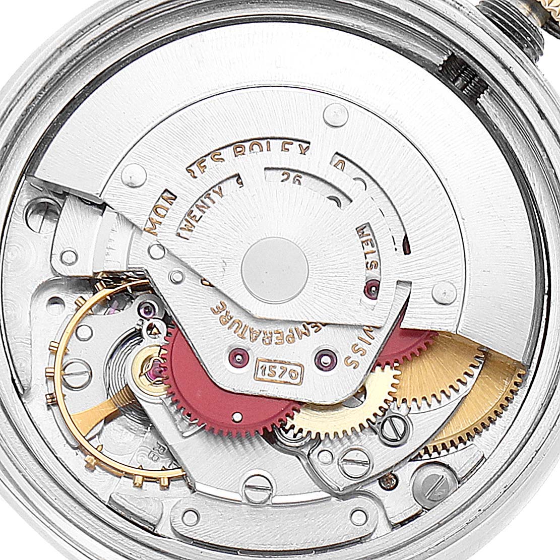 The image shows the inner movement mechanism of a Vintage Collection Rolex watch from a top-down angle.