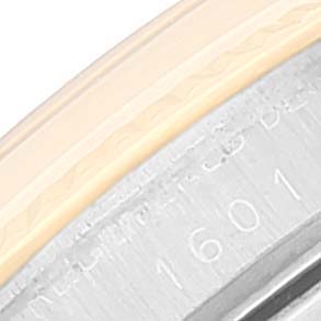 The image shows a close-up of the outer edge and engraved bezel of the Rolex Vintage Collection 1601 Men
s Steel and Gold (two tone) Champagne Dial 1601 Men
s Steel and Gold (two tone) Champagne Dial model 1601 watch.