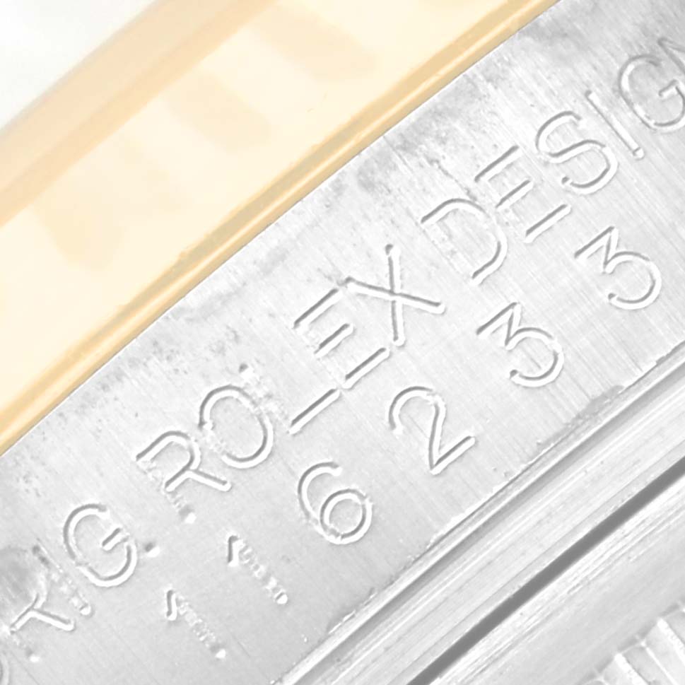 The image shows a close-up of the engraved text on the caseback rim of a Rolex Datejust 116233 Men's Steel and Gold (two tone) Silver Dial 116233 Men's Steel and Gold (two tone) Silver Dial watch.